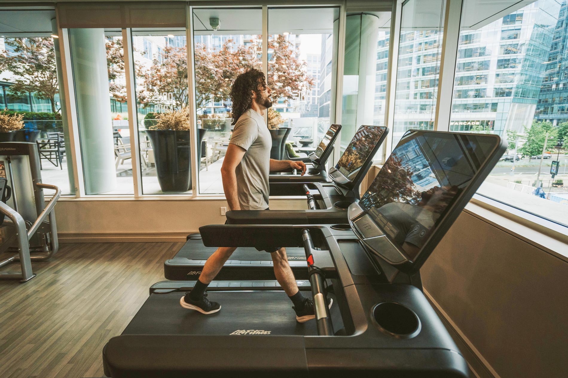 100 Pier 4 man walks on treadmill in fitness center