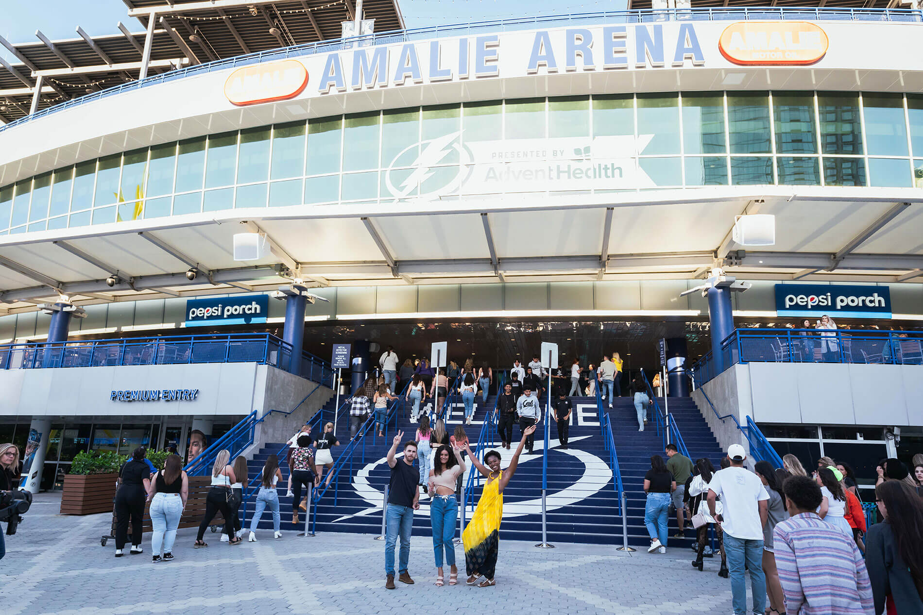 101 N. Meridian three friends smiling outside of Amalie Arena