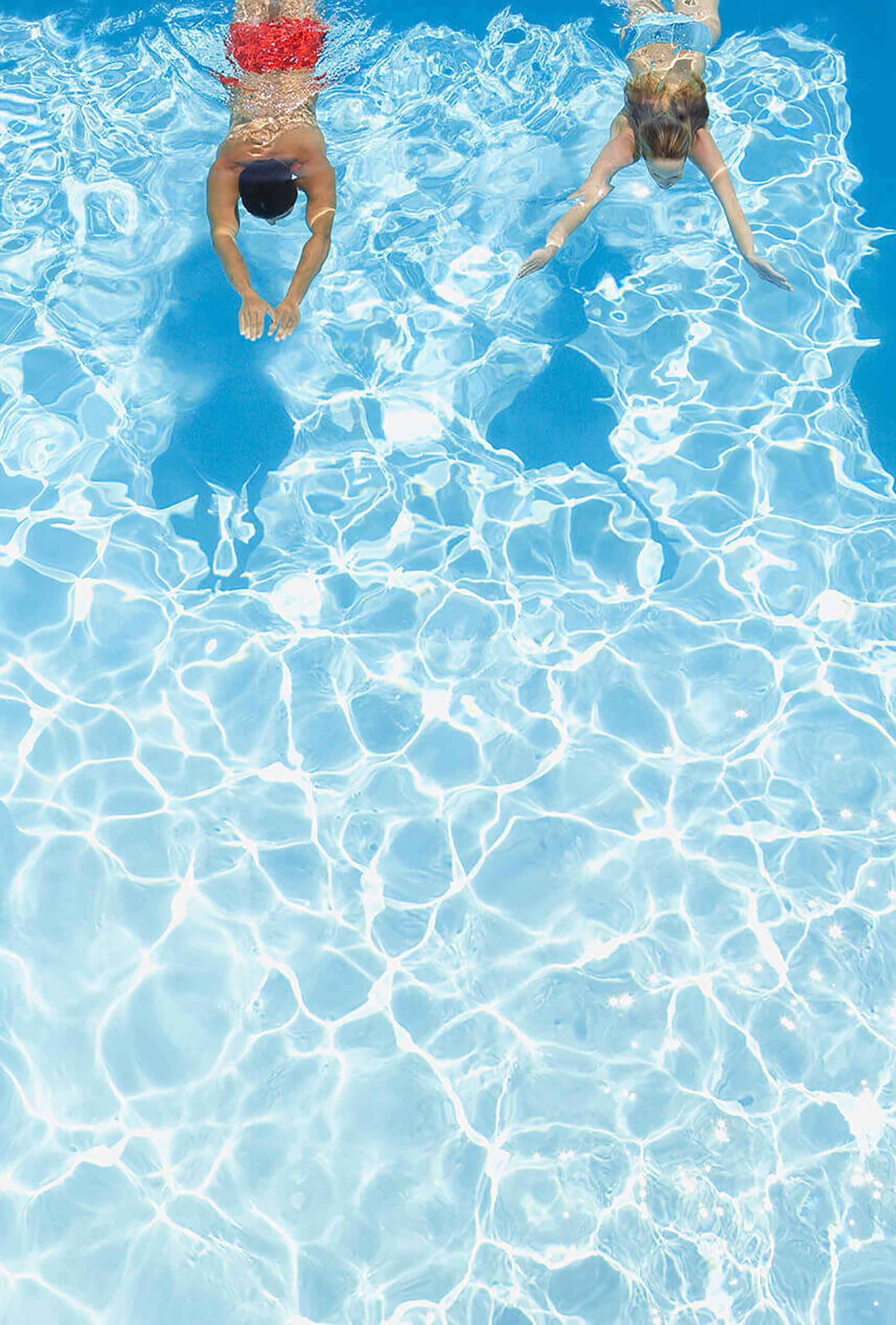 People swimming underwater