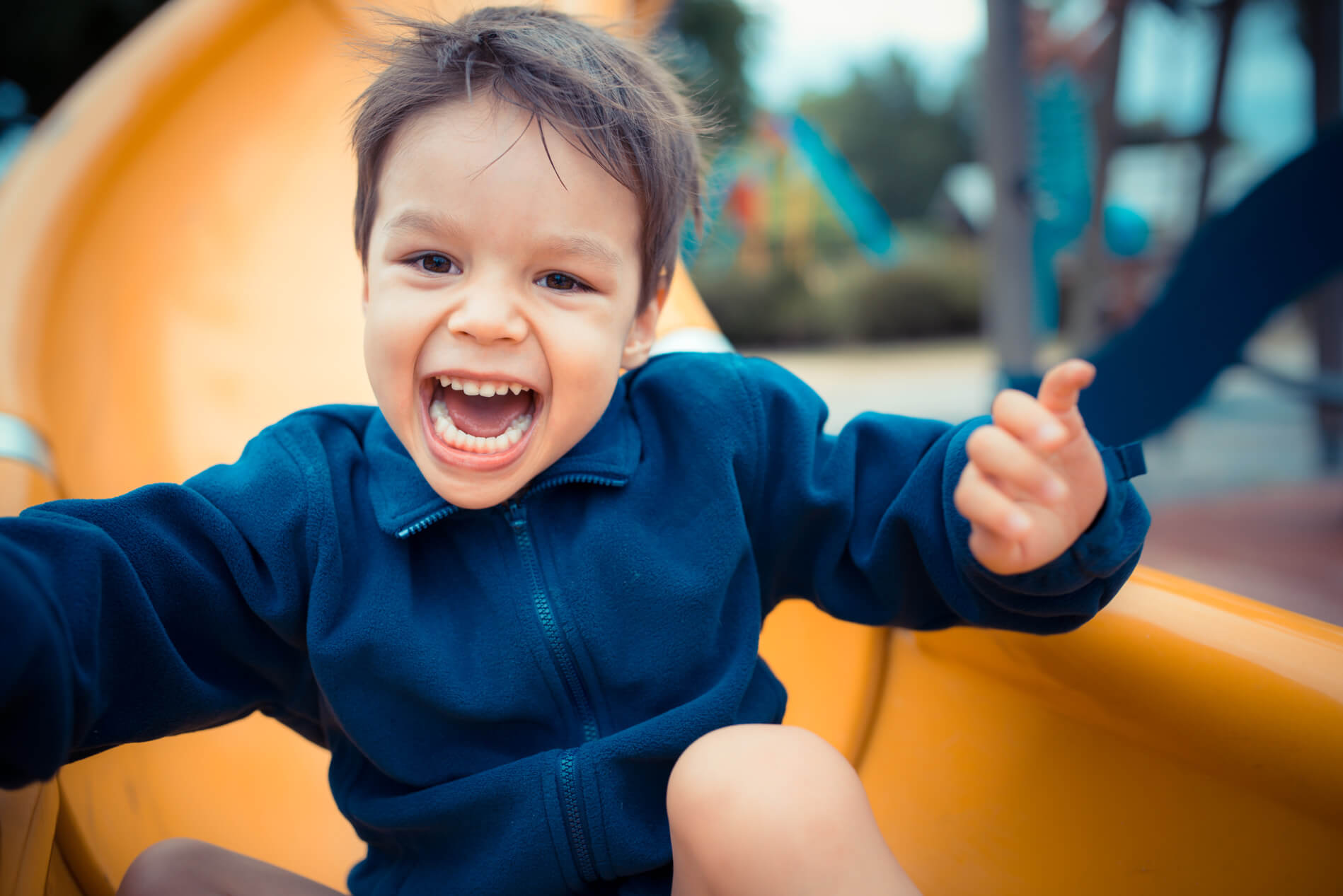 Kid sliding on playground