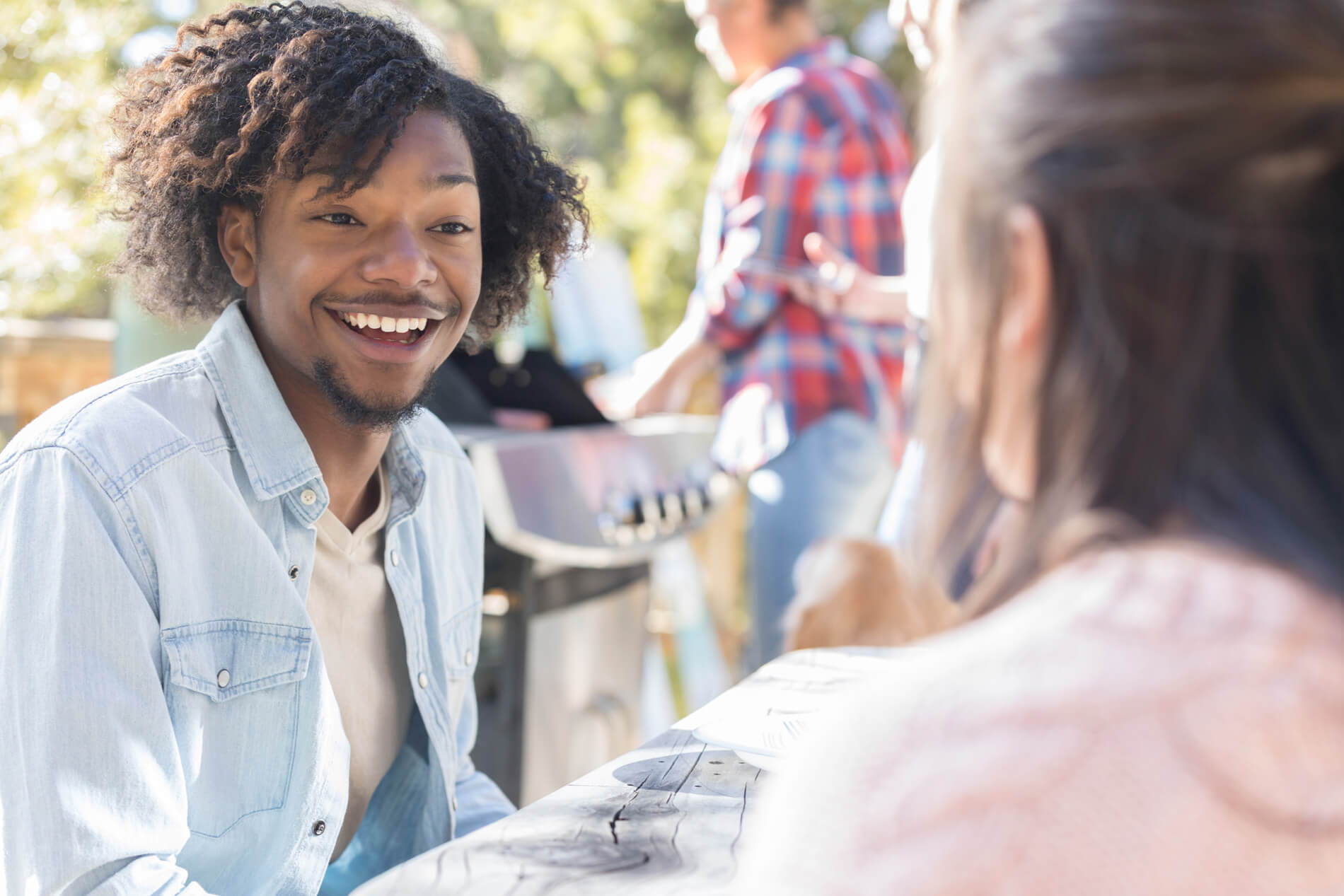 Friends grilling outside