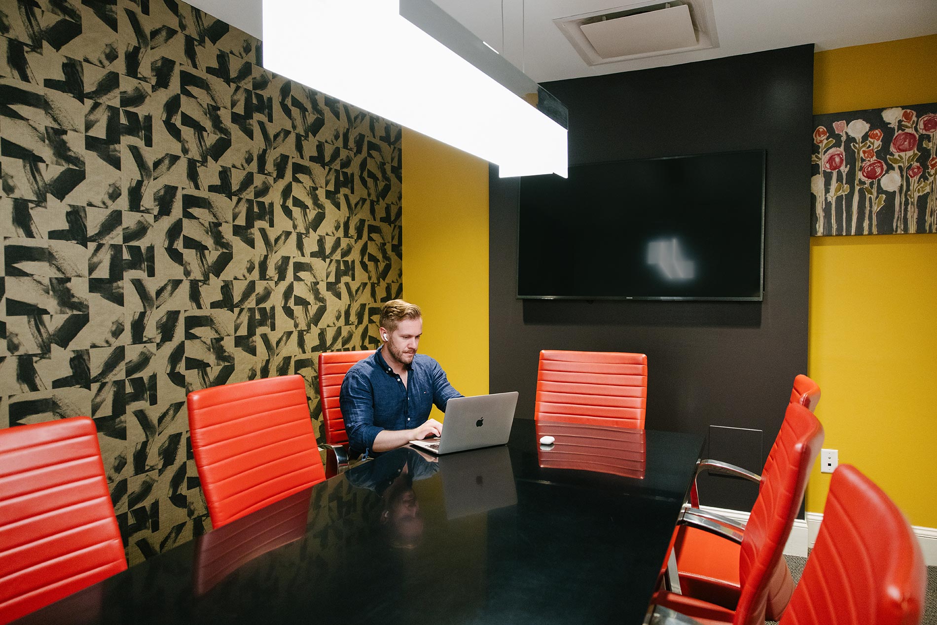 Andover House man works in conference room