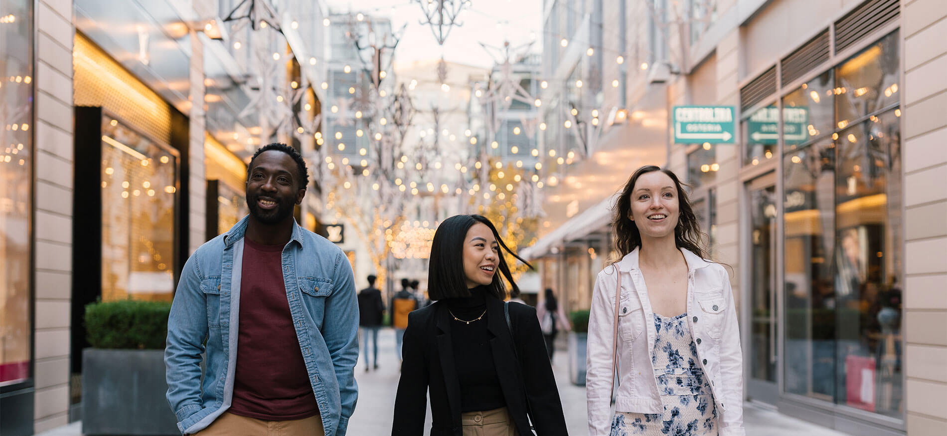 Three friends walking downtown