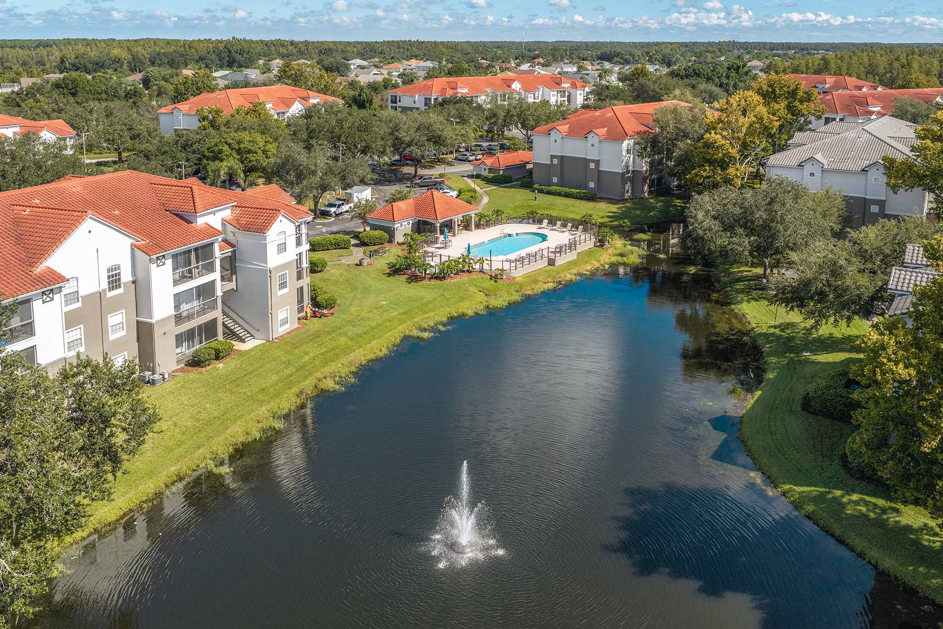 Andover Place at Cross Creek aerial building and pond view