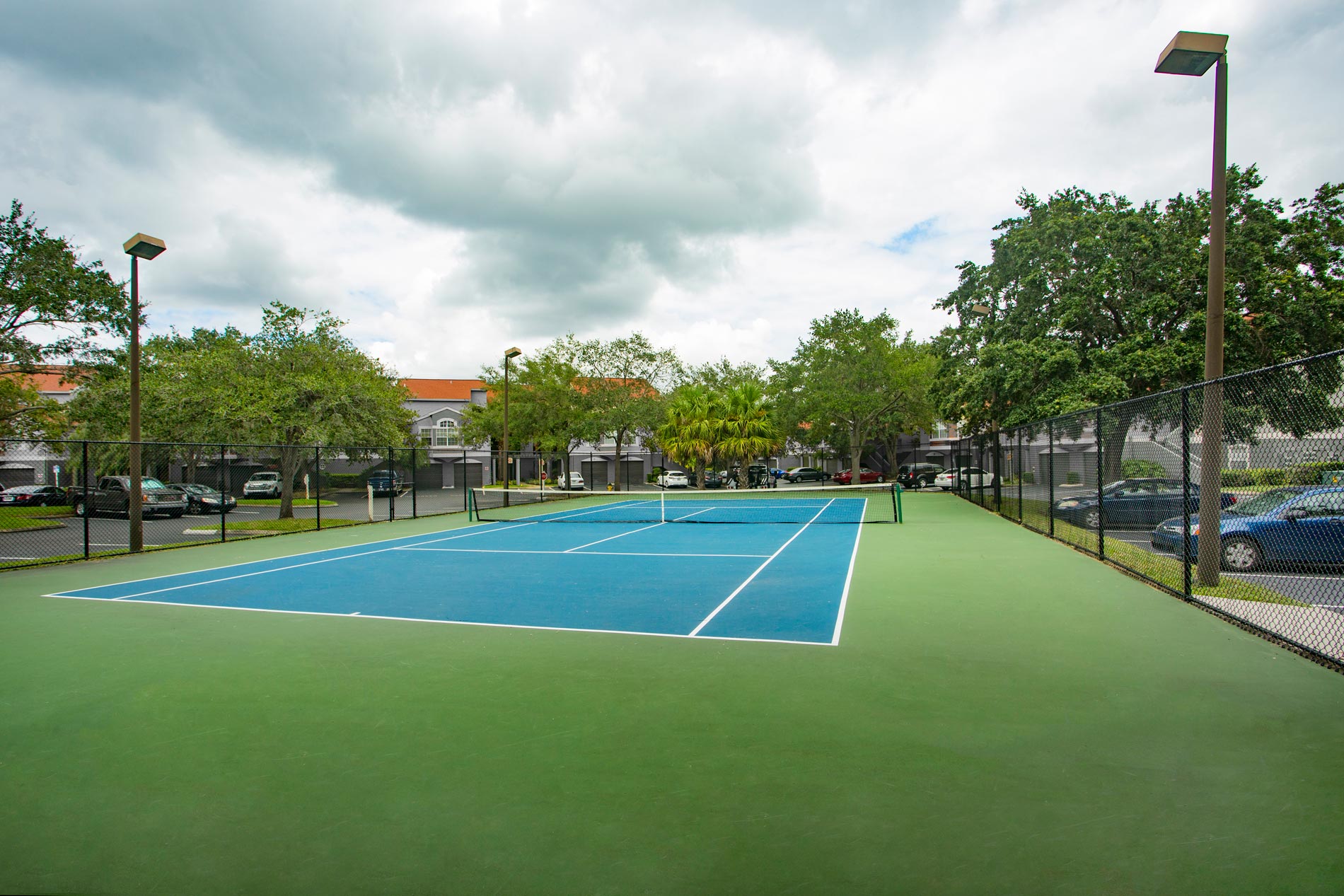 Arbors at Lee Vista Apartments Tennis Court