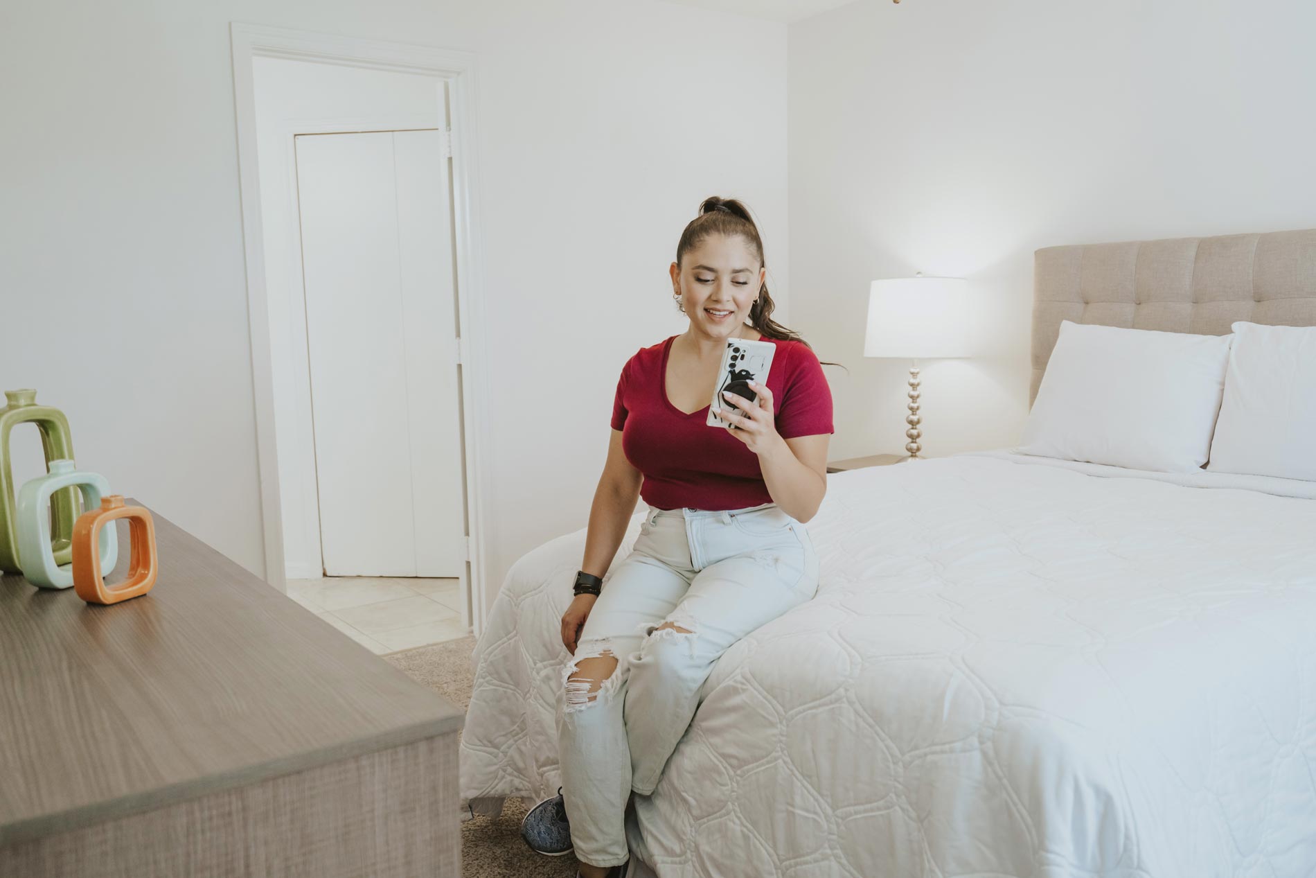 Arbors Lee Vista woman in staged bedroom