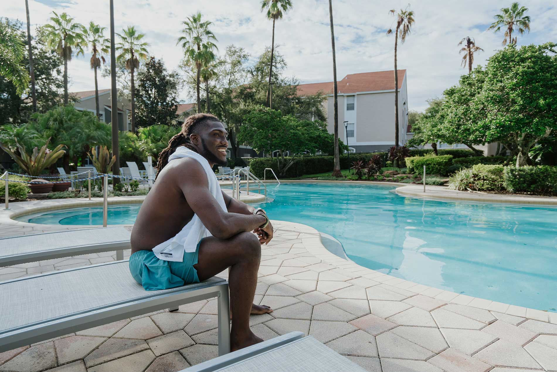 Happy man at the swimming pool