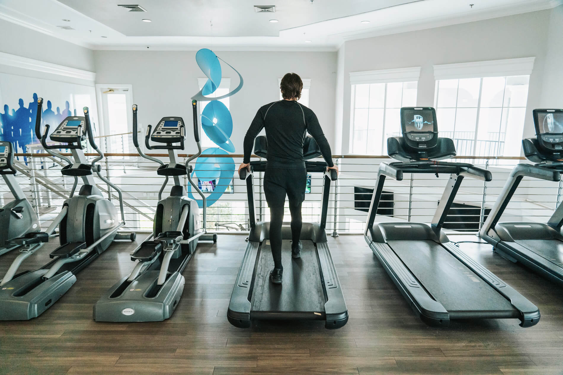 Arbors At Maitland man exercises in fitness center