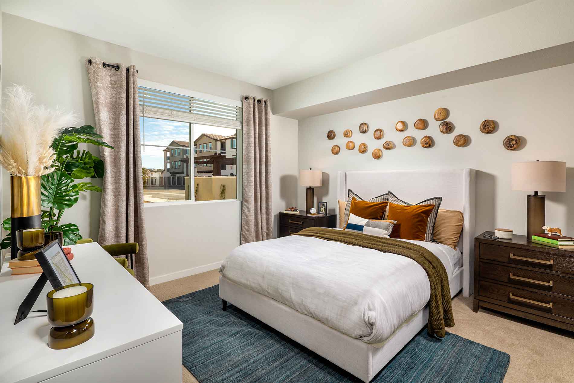 Comfortable primary bedroom inside an Avena apartment in Menifee, CA