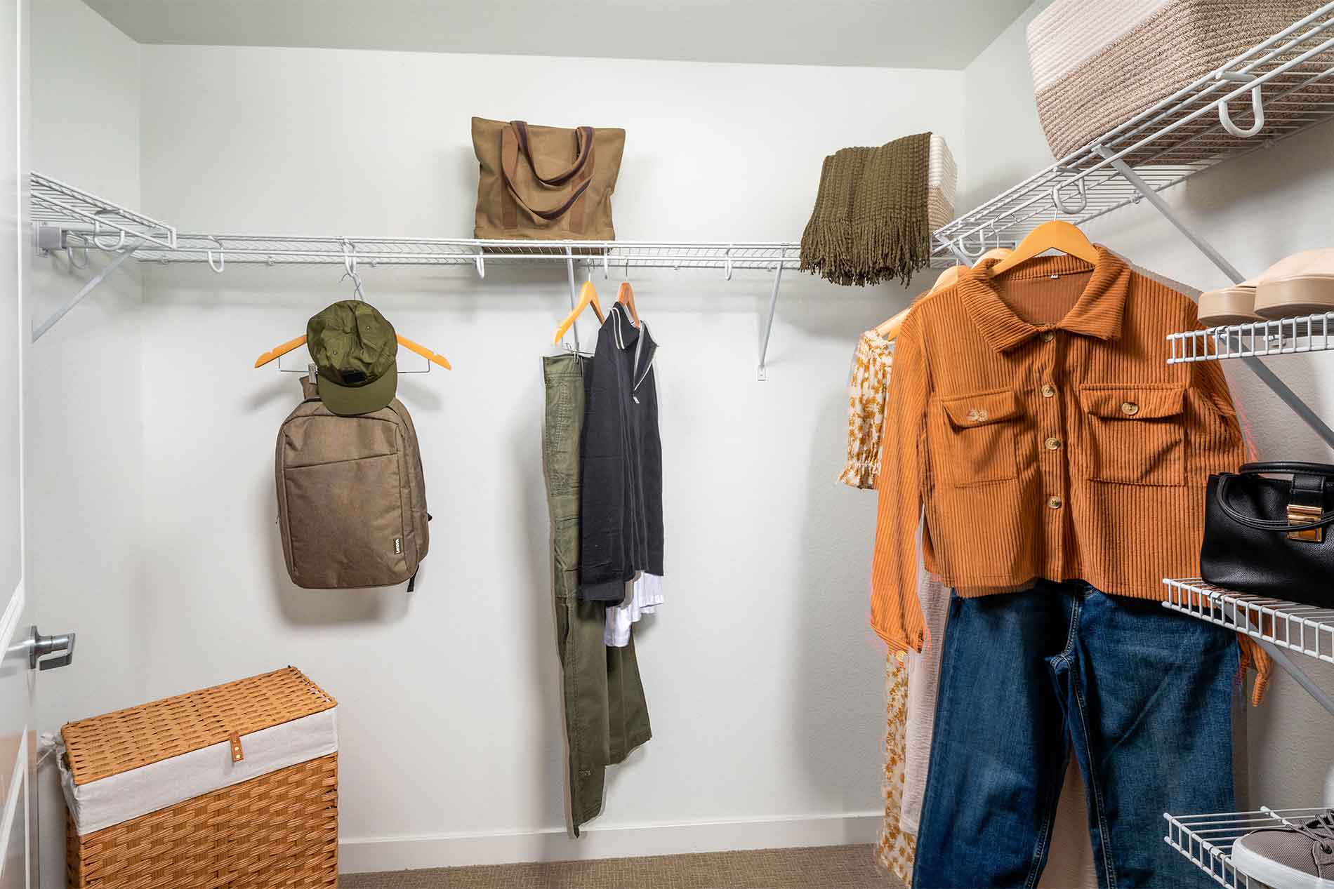 Walk-in closet with storage at Avena apartments in Menifee