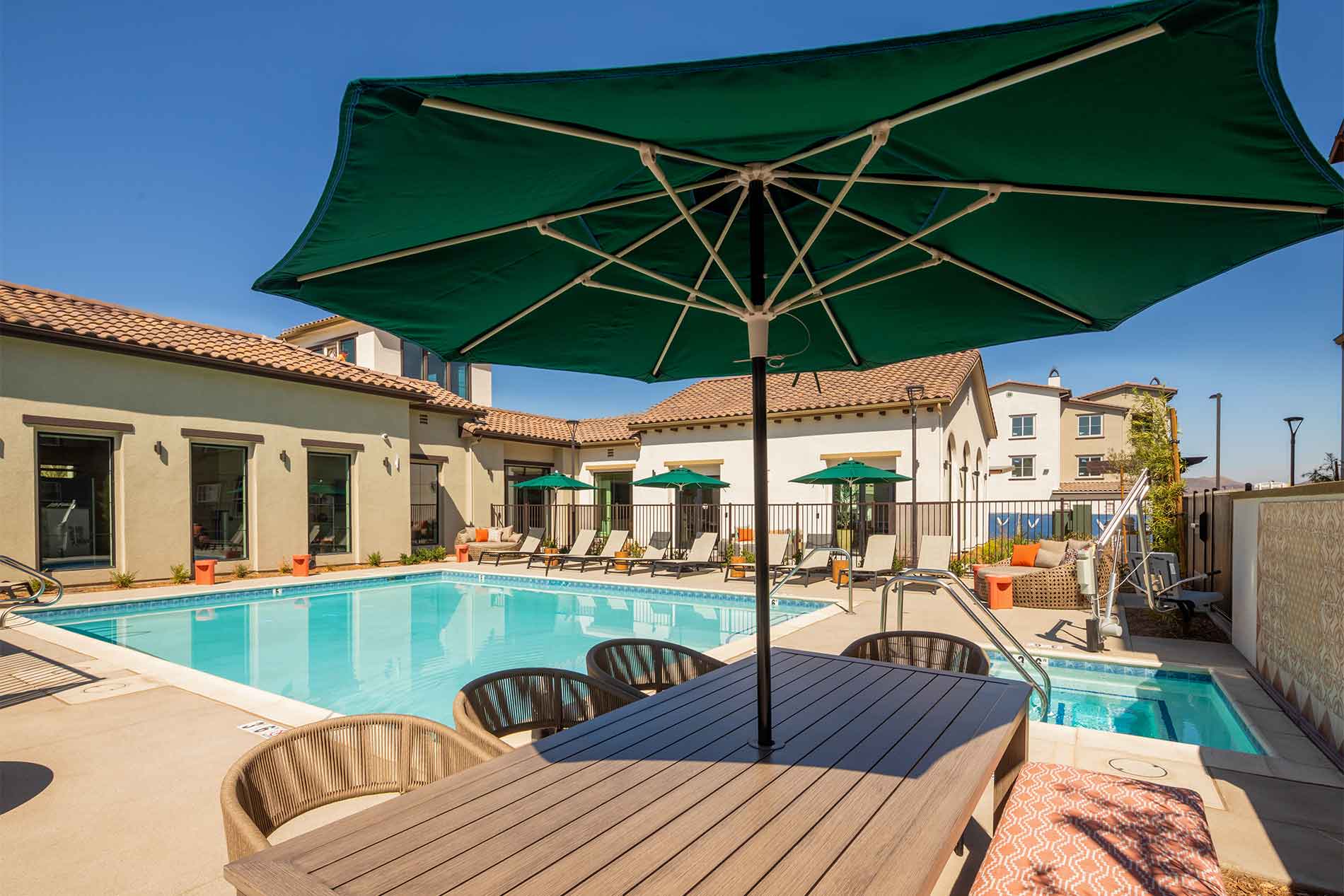 Avena swimming pool with shaded outdoor seating in Menifee, CA