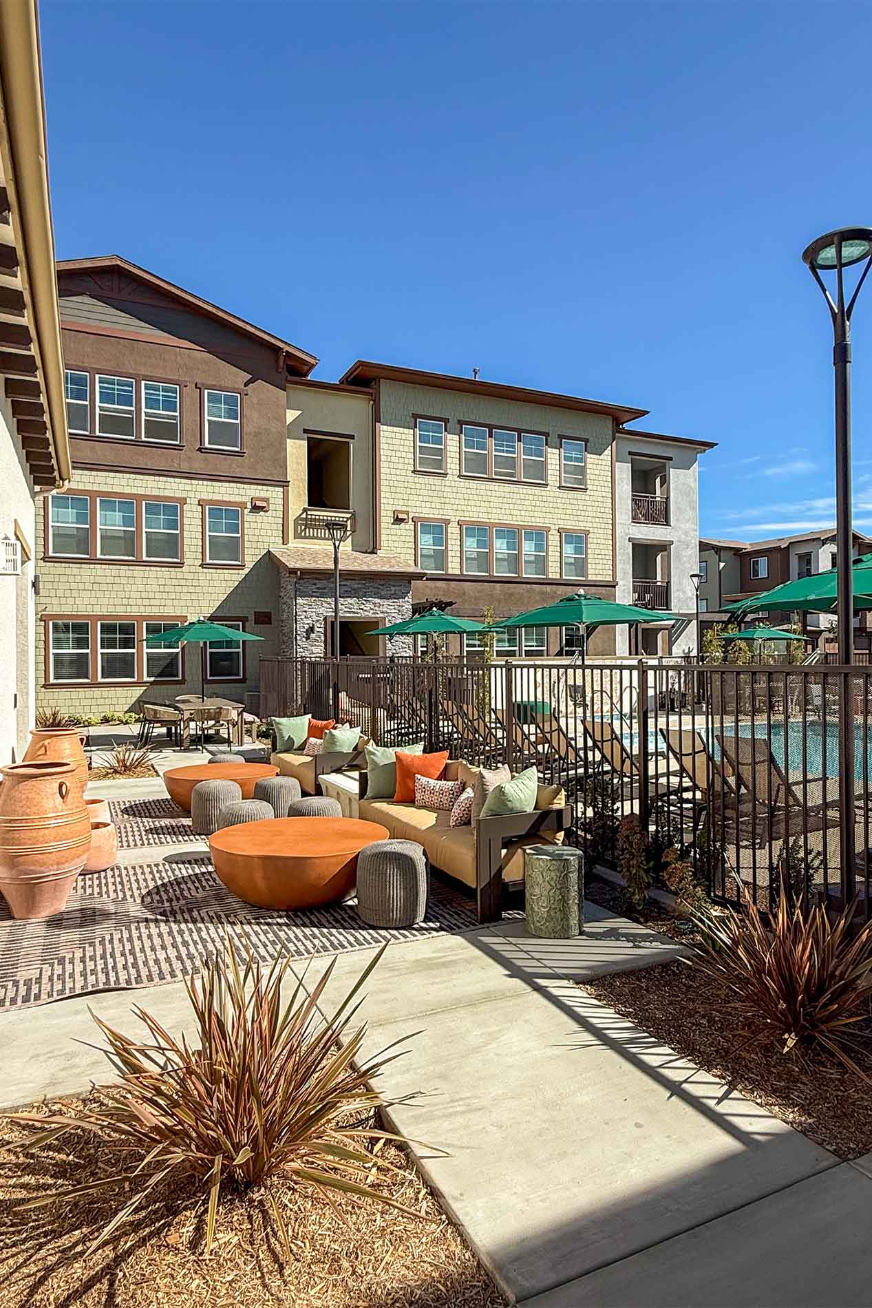 Avena swimming pool with shaded outdoor seating in Menifee, CA