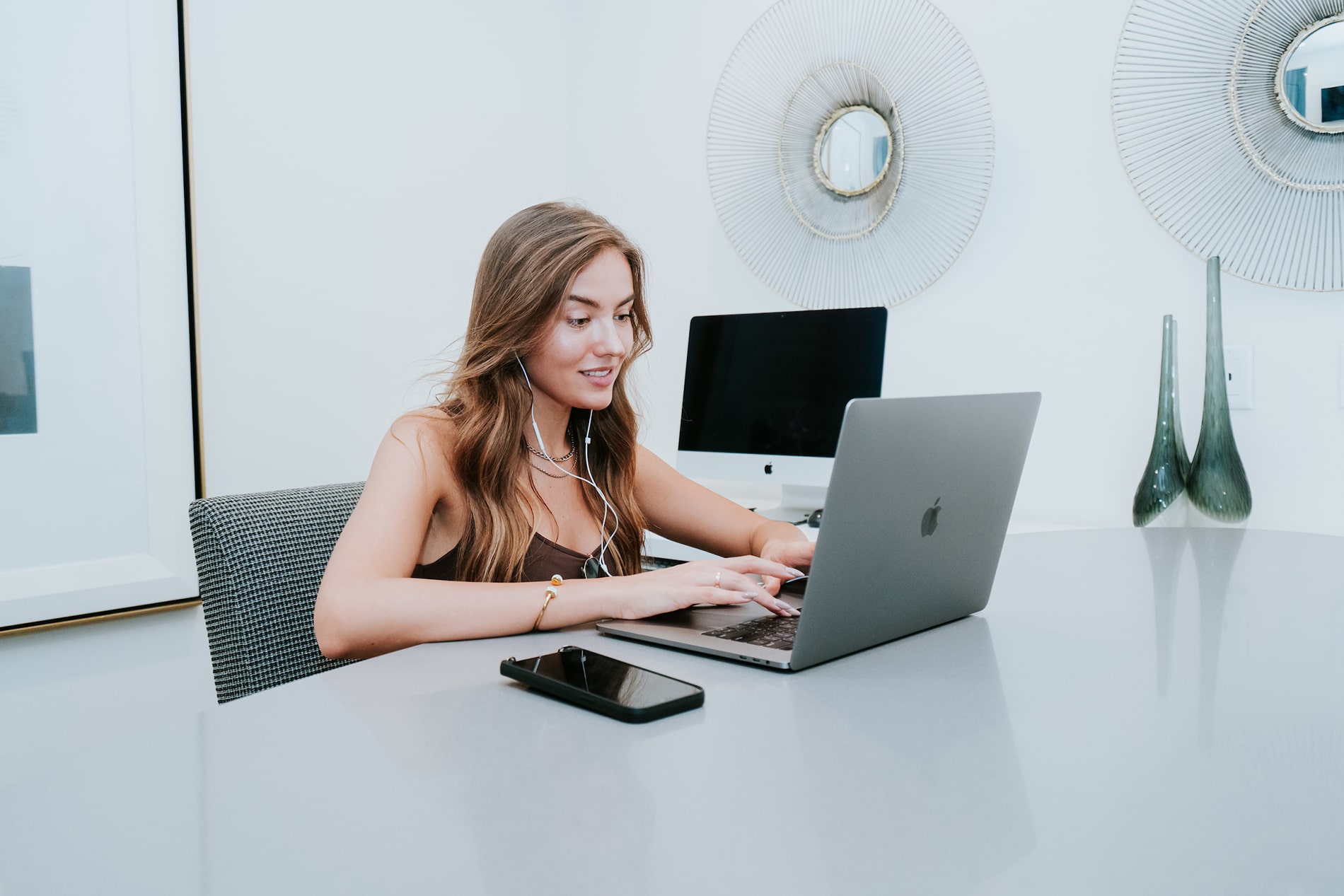 Woman at laptop in Beach & Ocean business center Woman at laptop in Beach & Ocean business center