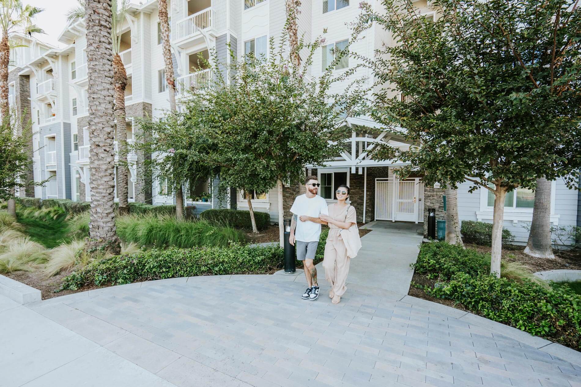 Beach and Ocean couple walking exterior building