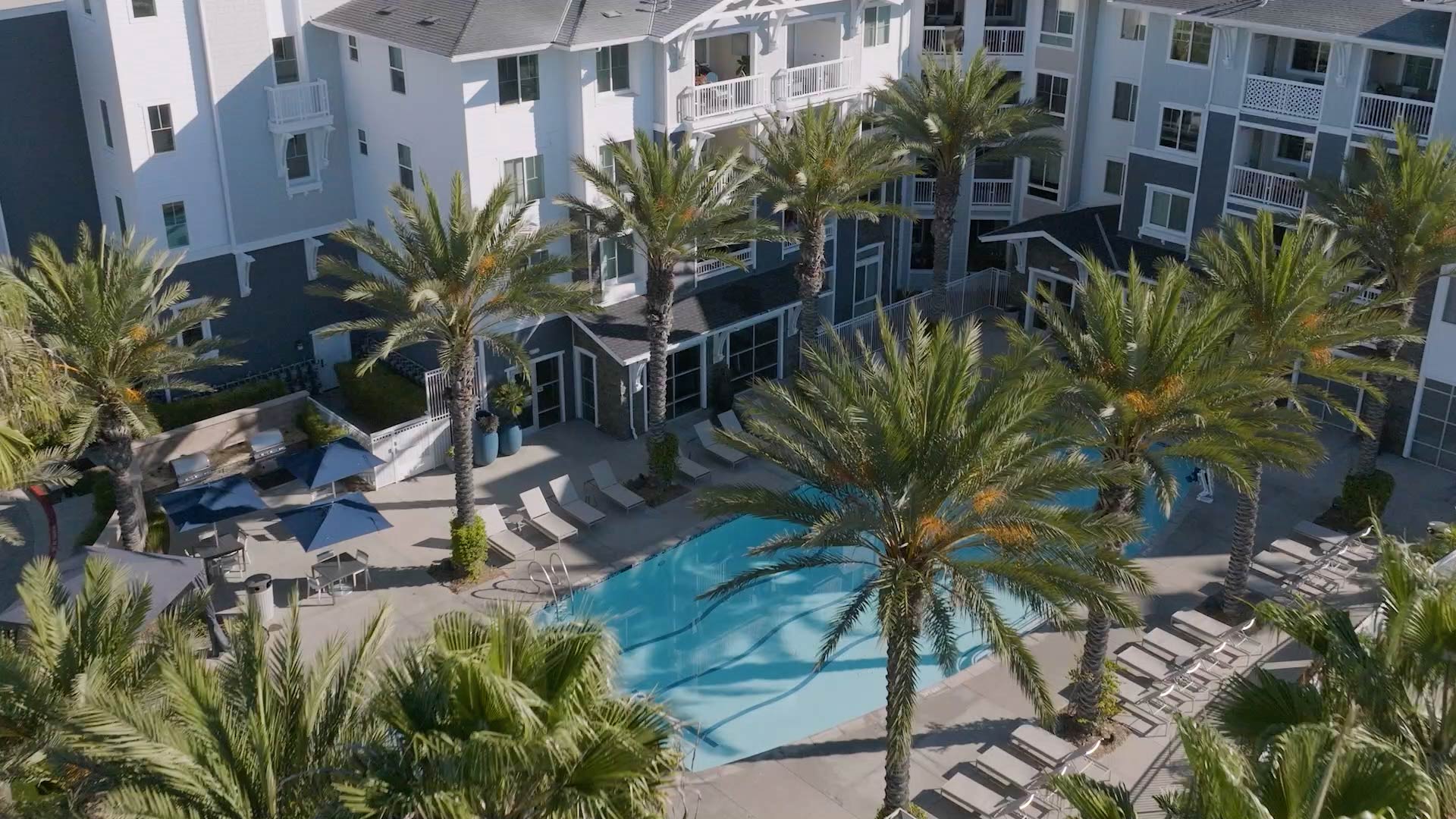 Beach And Ocean aerial pool and building exterior