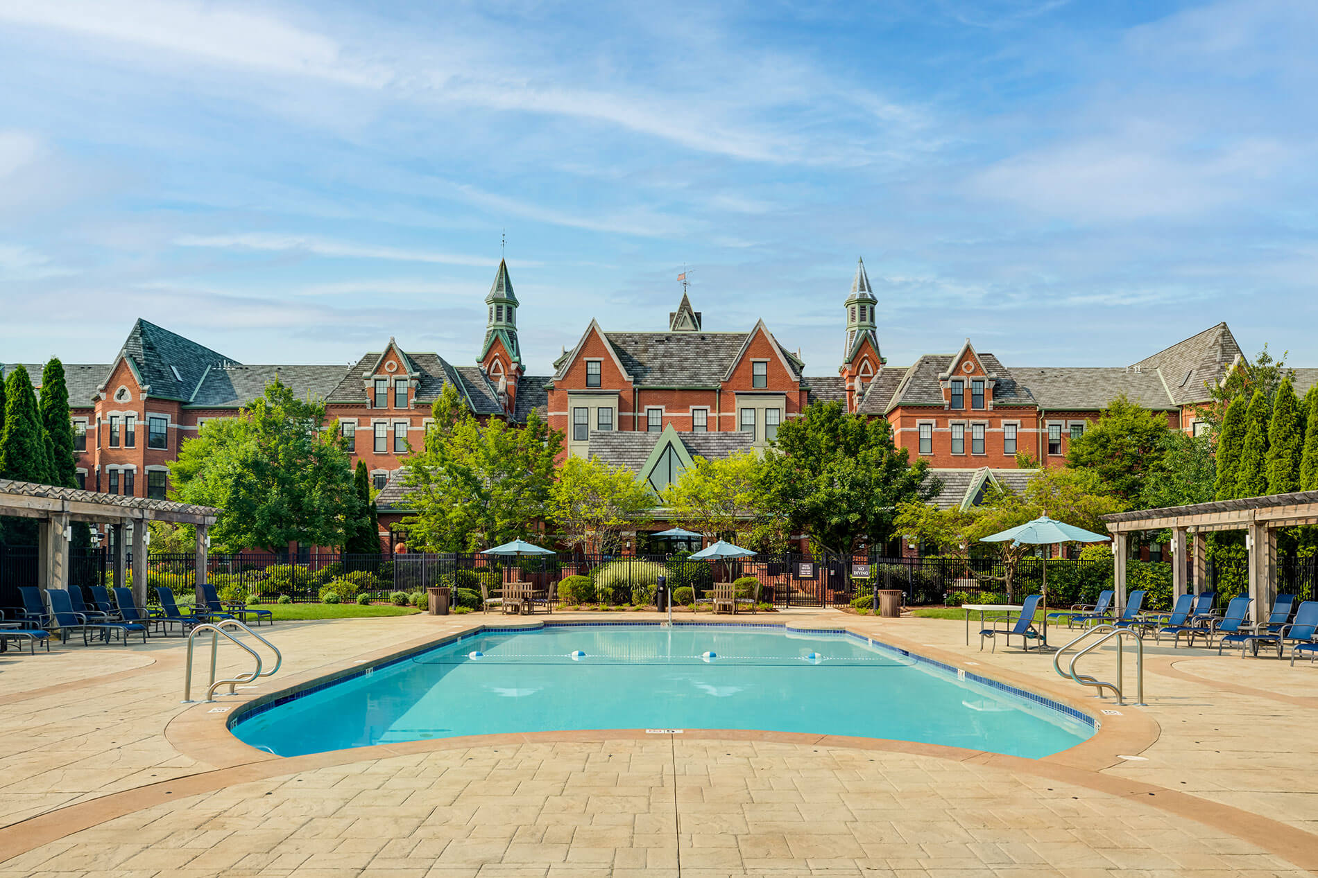 Bradlee Danvers swimming pool with building in the background