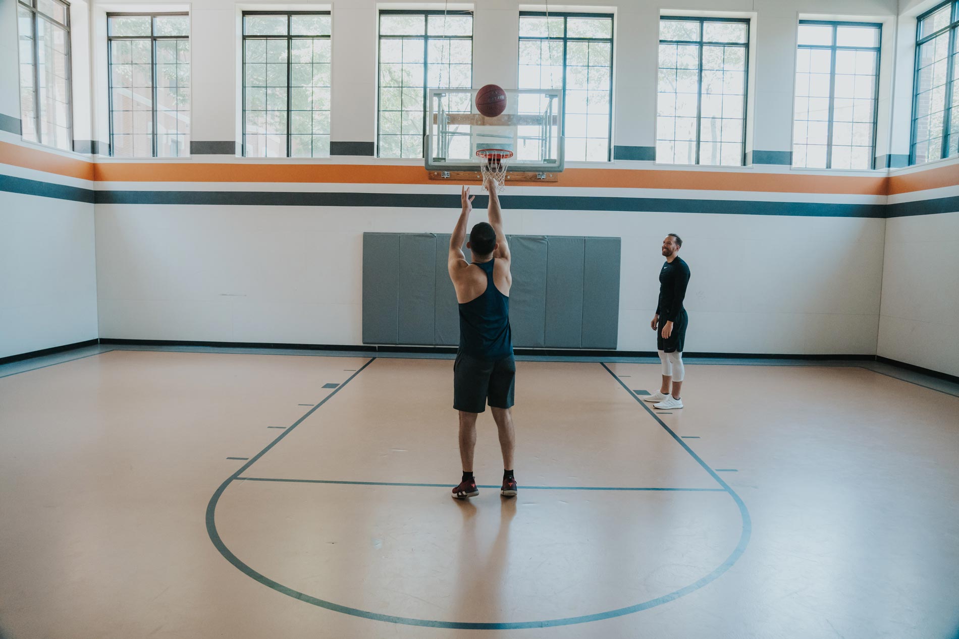 Bradlee Danvers two men play basketball