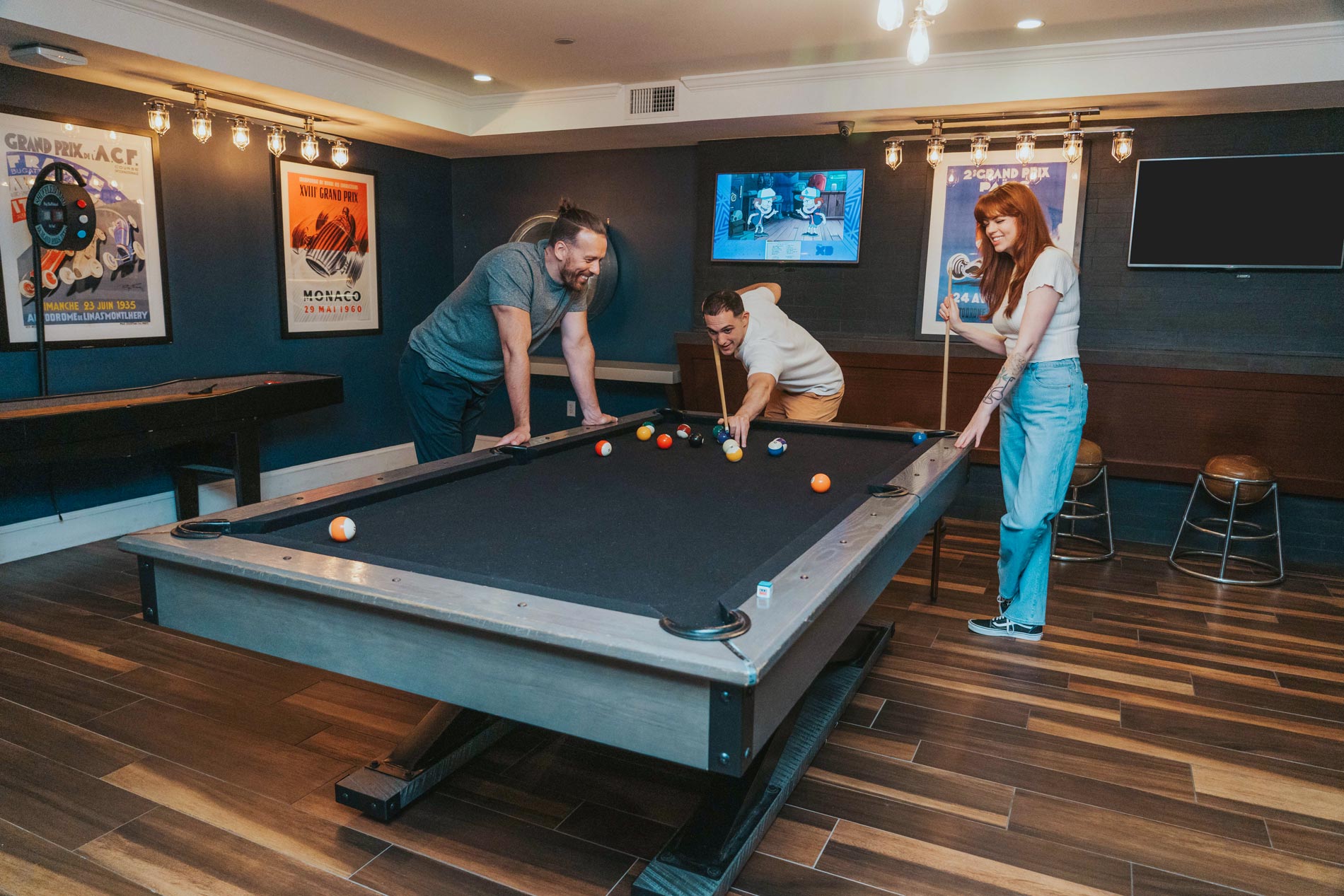 Bradlee Danvers three people play pool