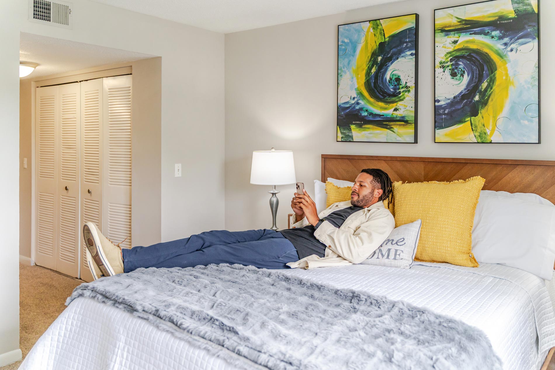 Brookridge man lays on bed with phone