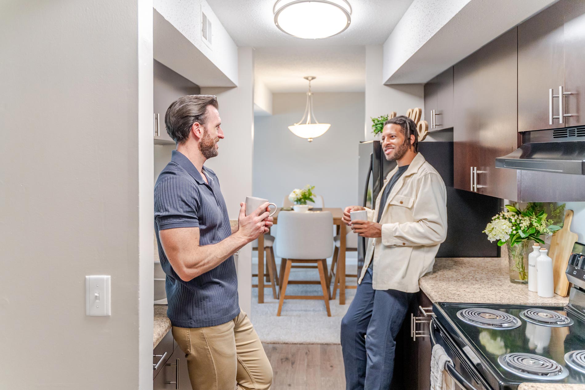 Brookridge two men stand in kitchen