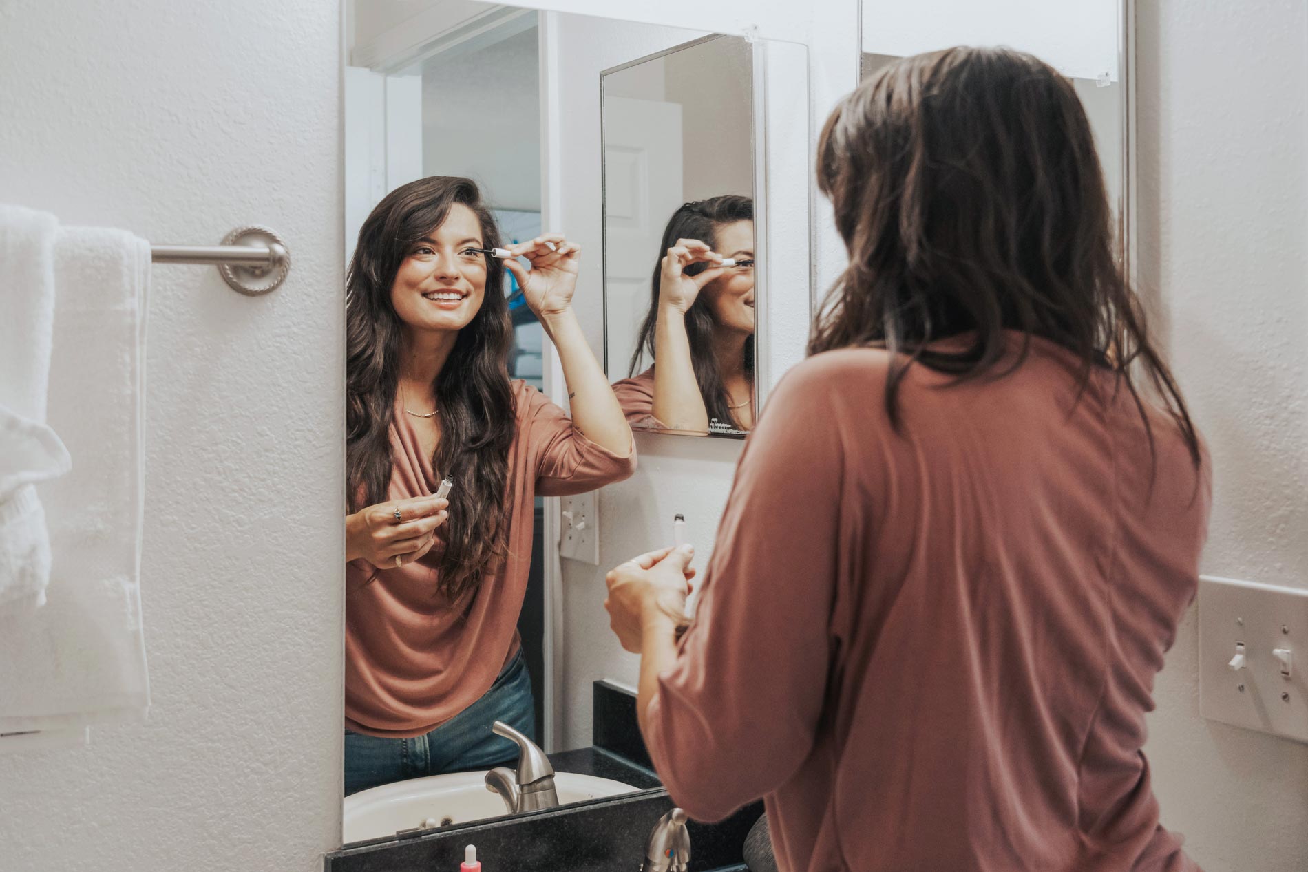 Cambridge Woods woman gets ready in bathroom