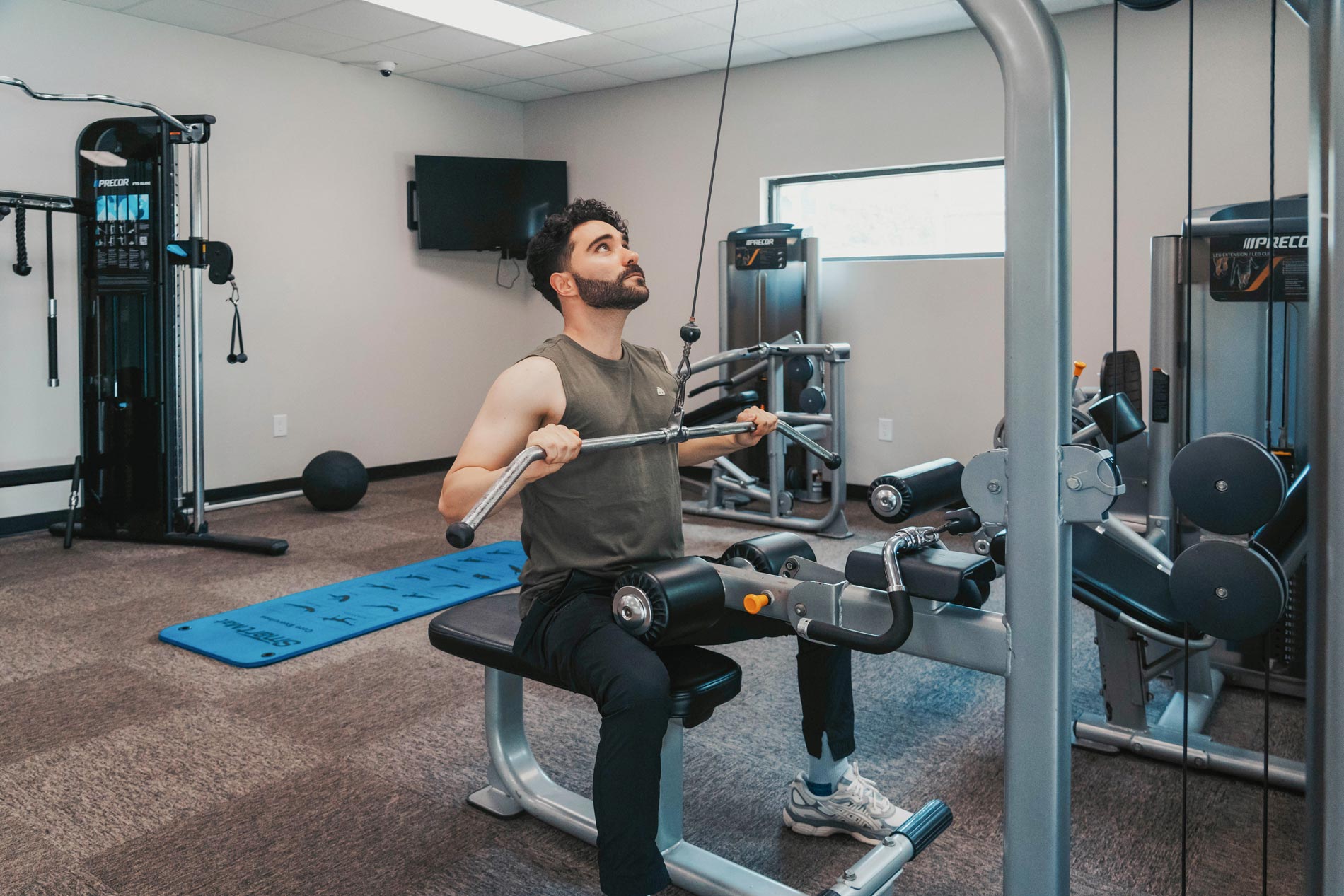 Cambridge Woods man exercises in fitness center