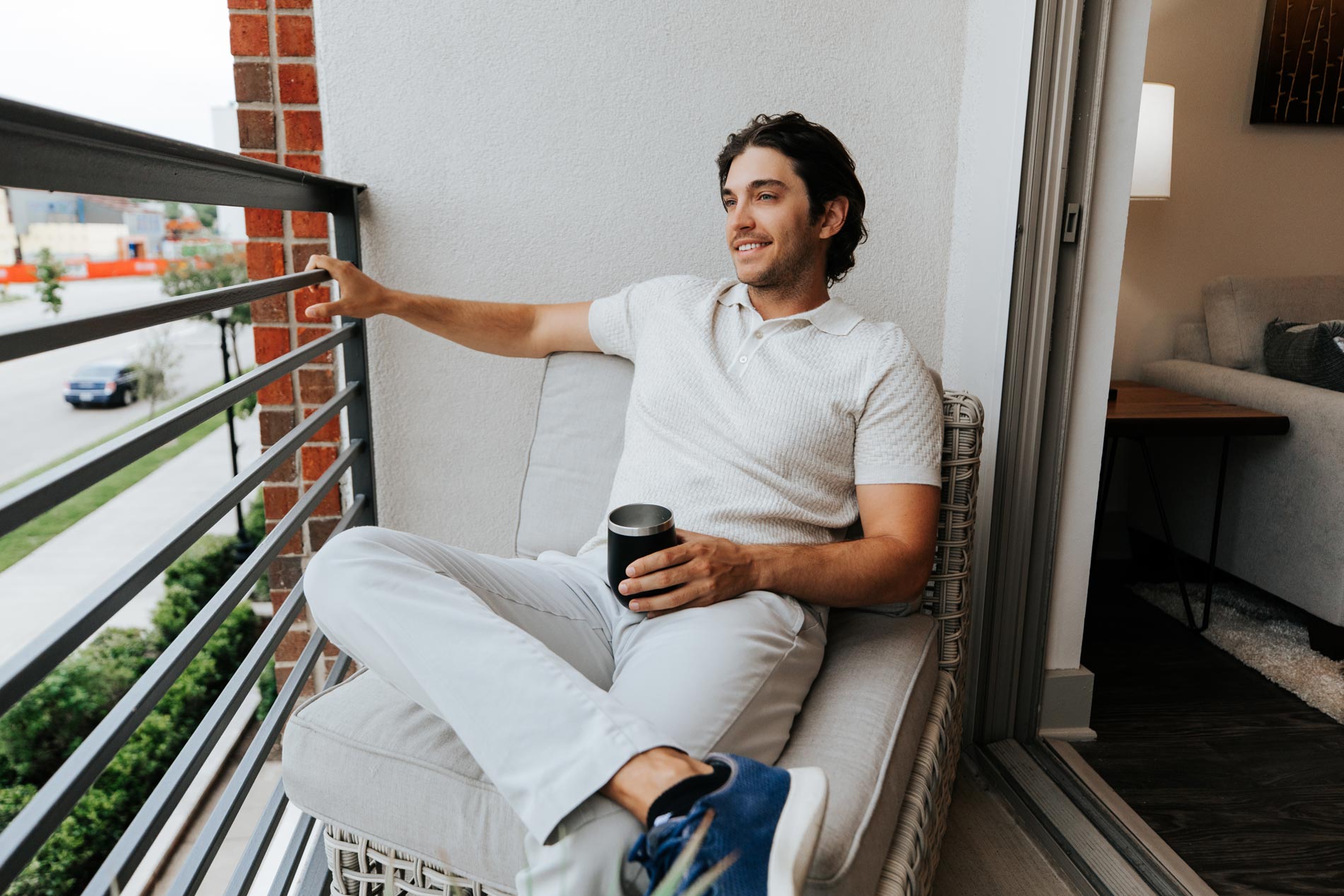 Central Square man sits on patio with coffee