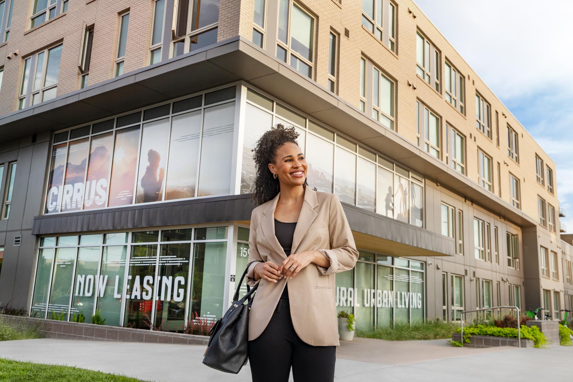 Cirrus Woman In Front of Leasing Office