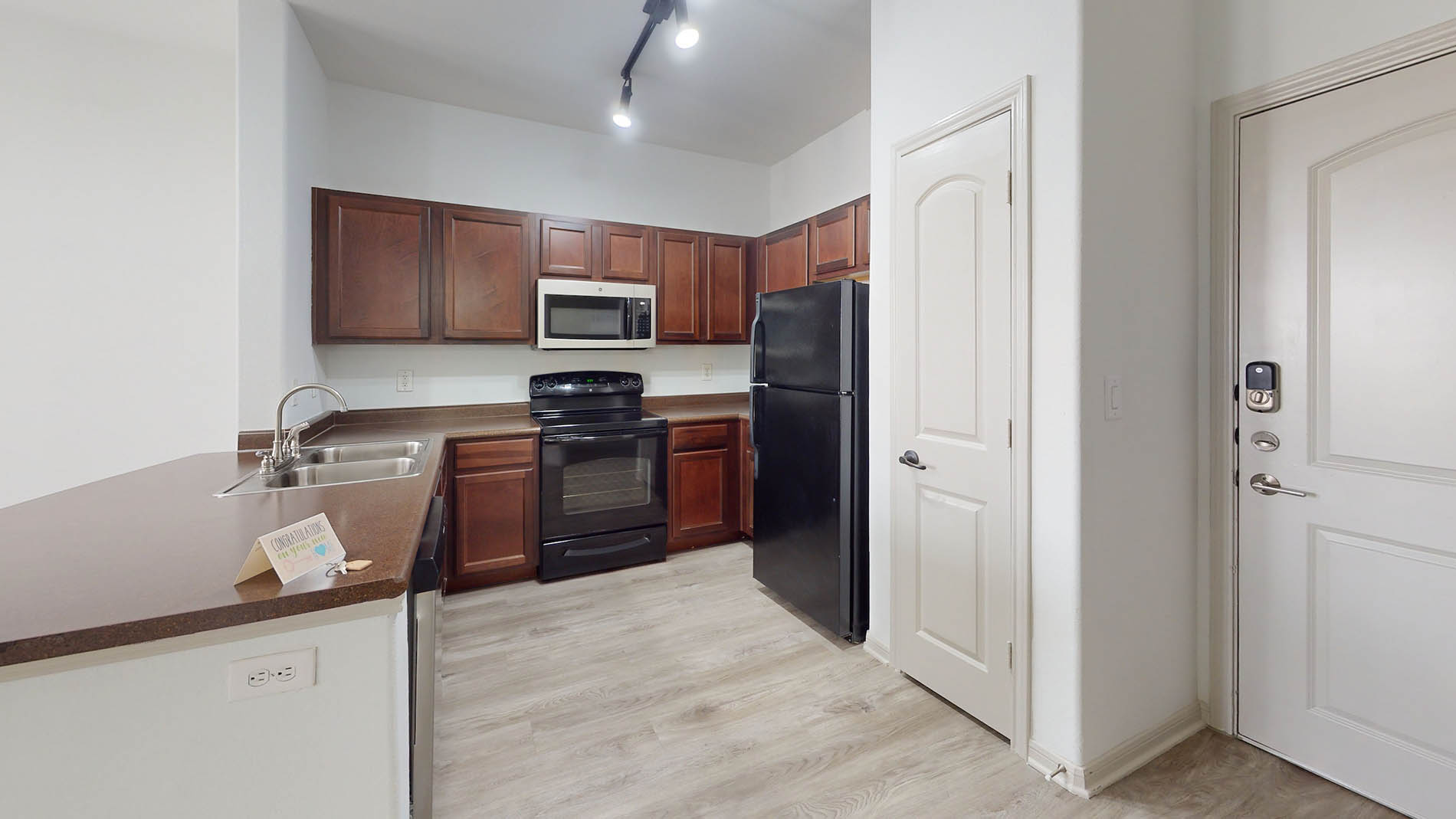 Cool Springs apartment kitchen with black appliances