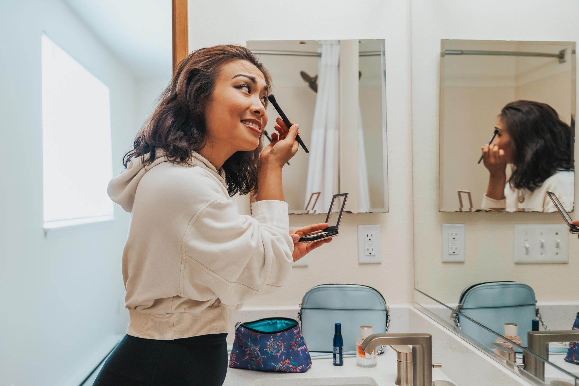 Crown Pointe woman gets ready in bathroom