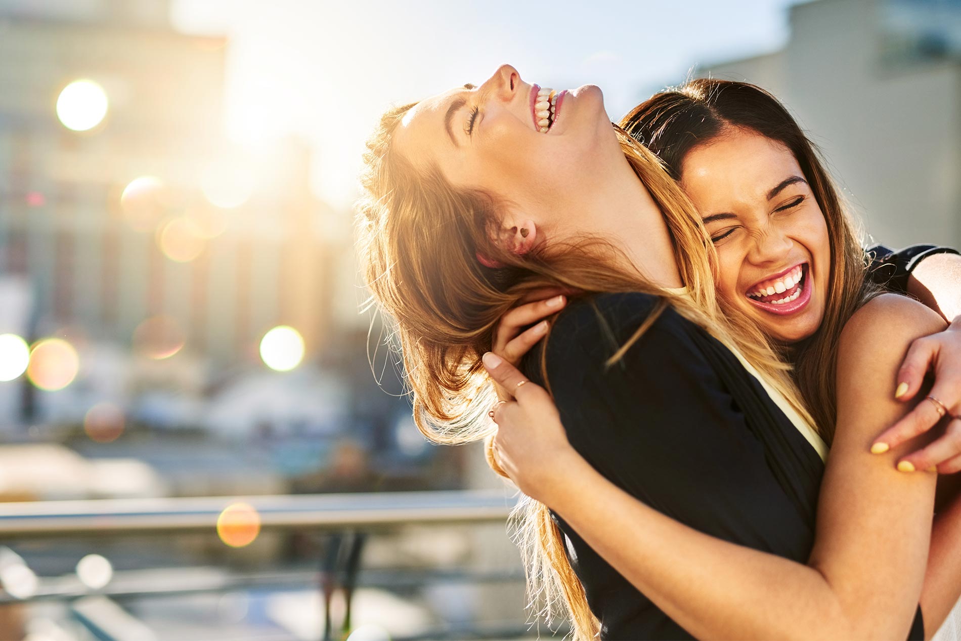 Two happy women on rooftop