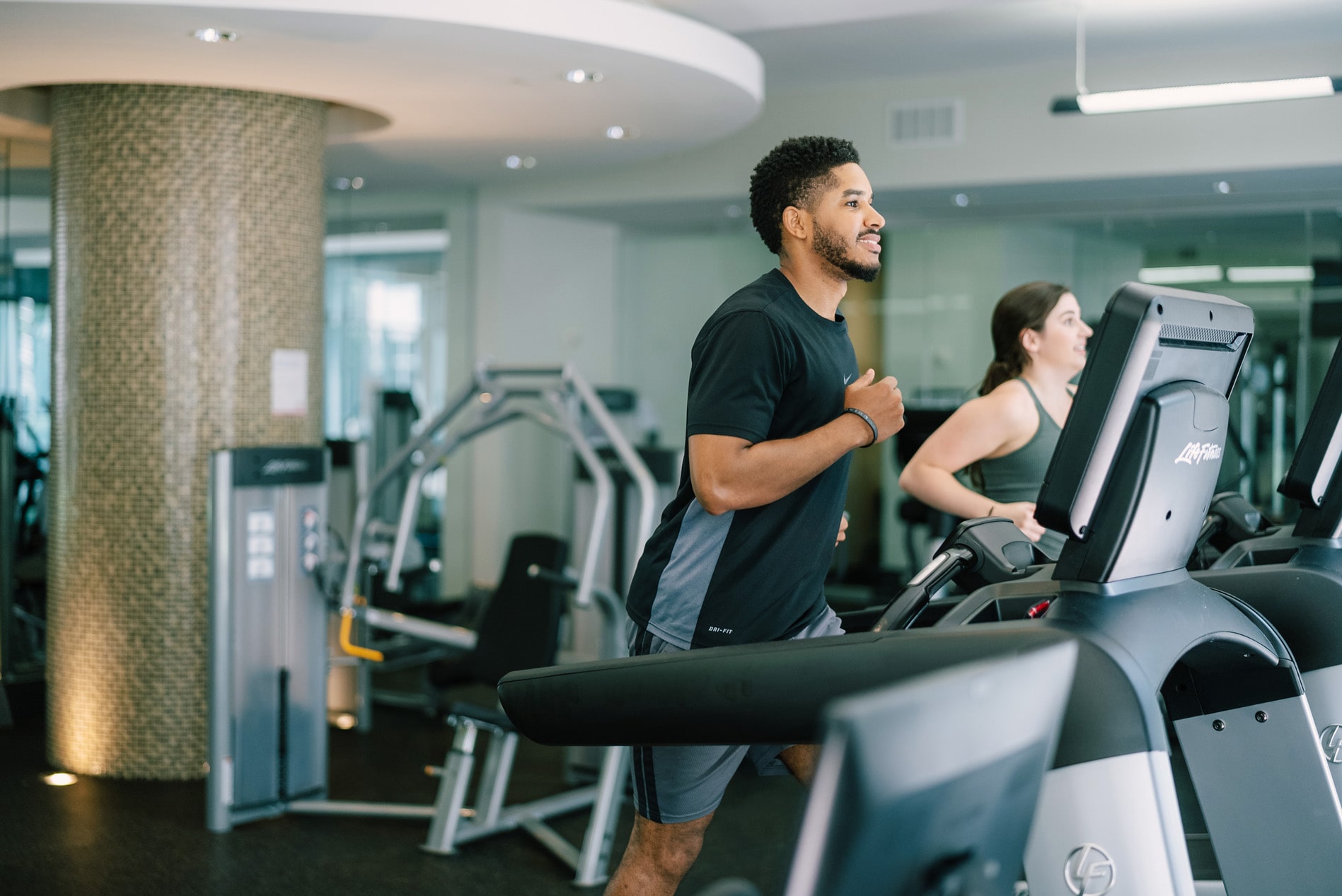 Domus Apartments man in gym