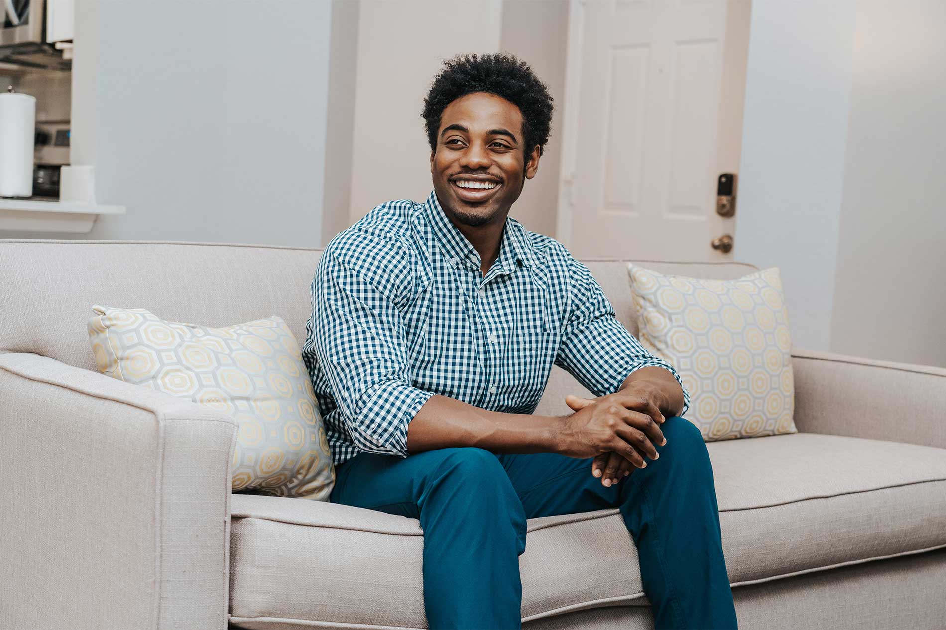 Happy man lounging on the couch