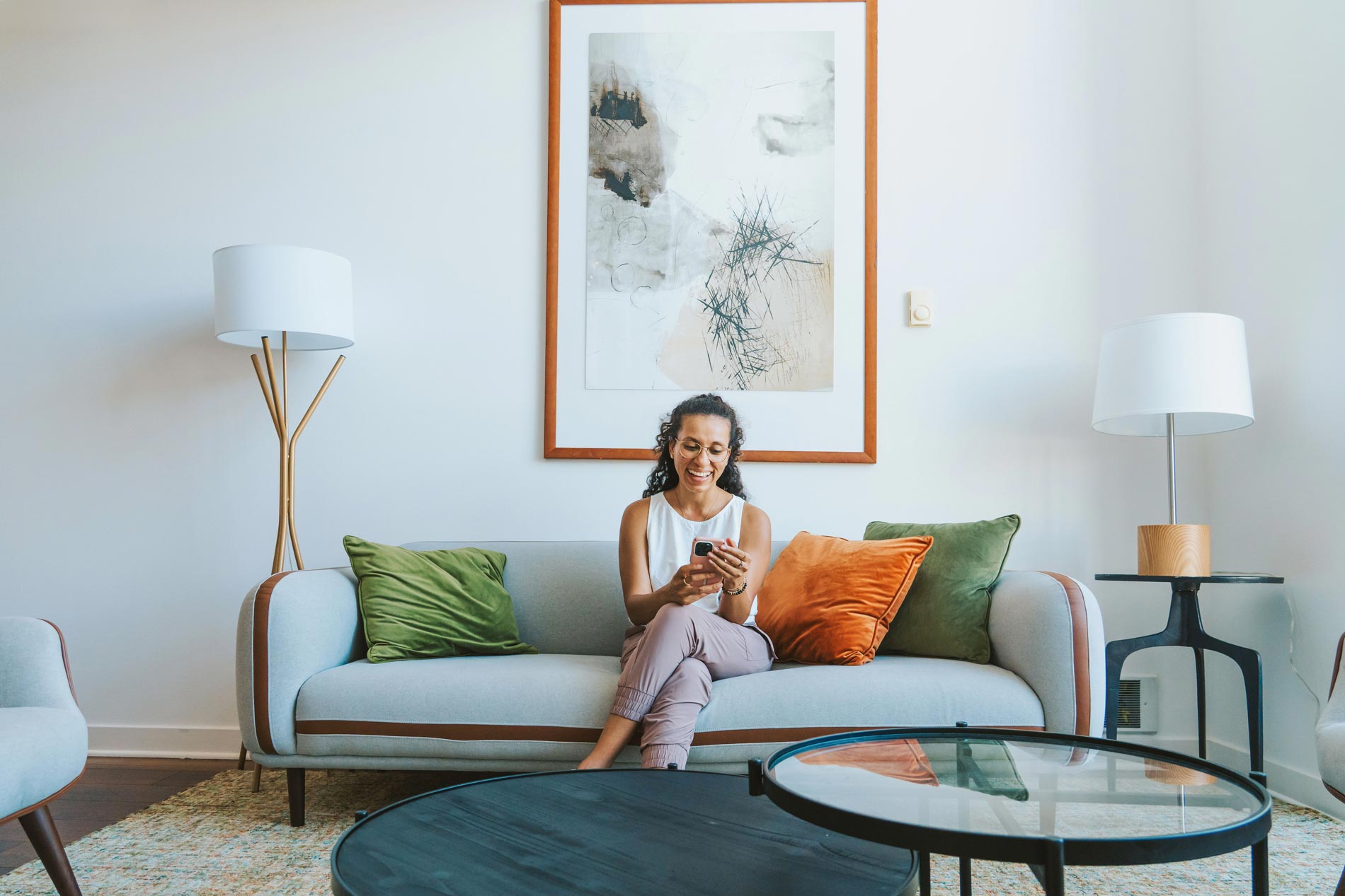 Edgewater woman on phone in living room