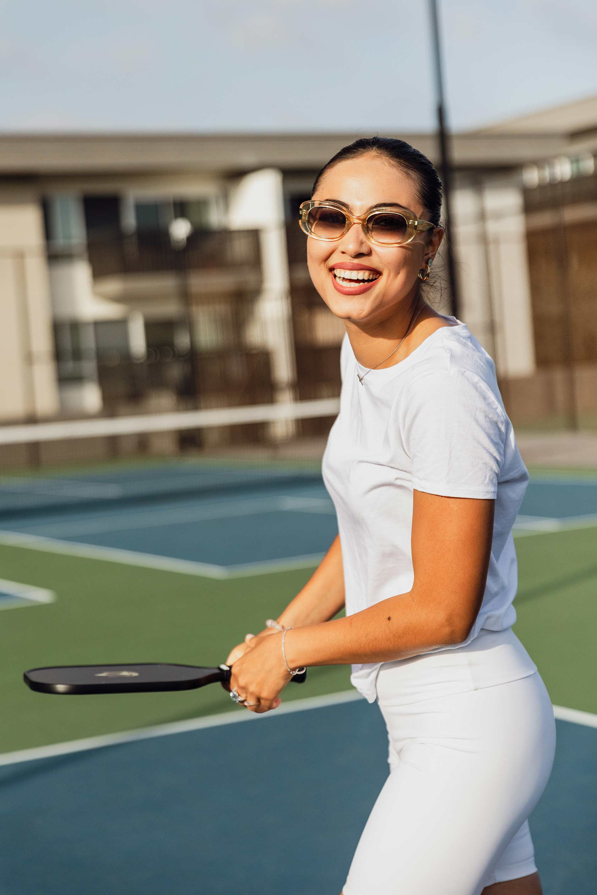 Eight 80 woman plays pickleball