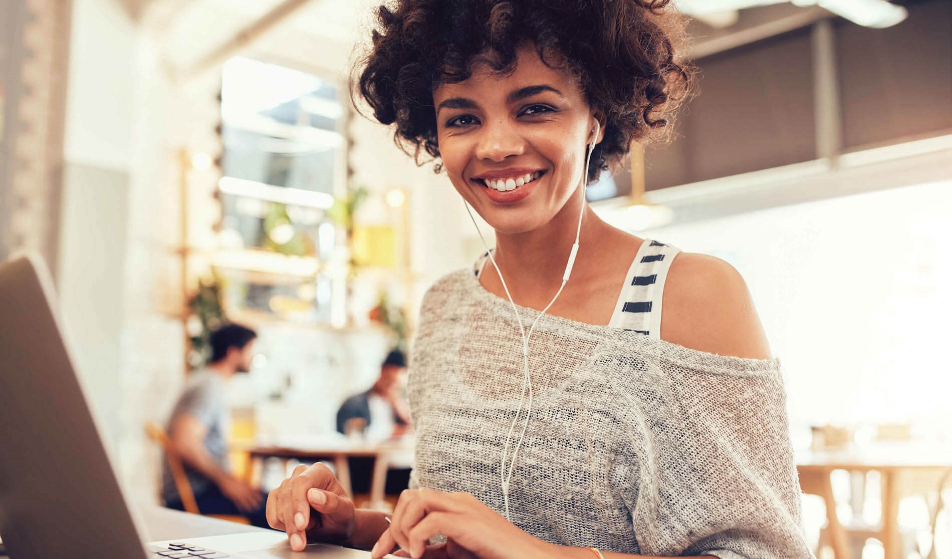 Smiling woman working on laptop