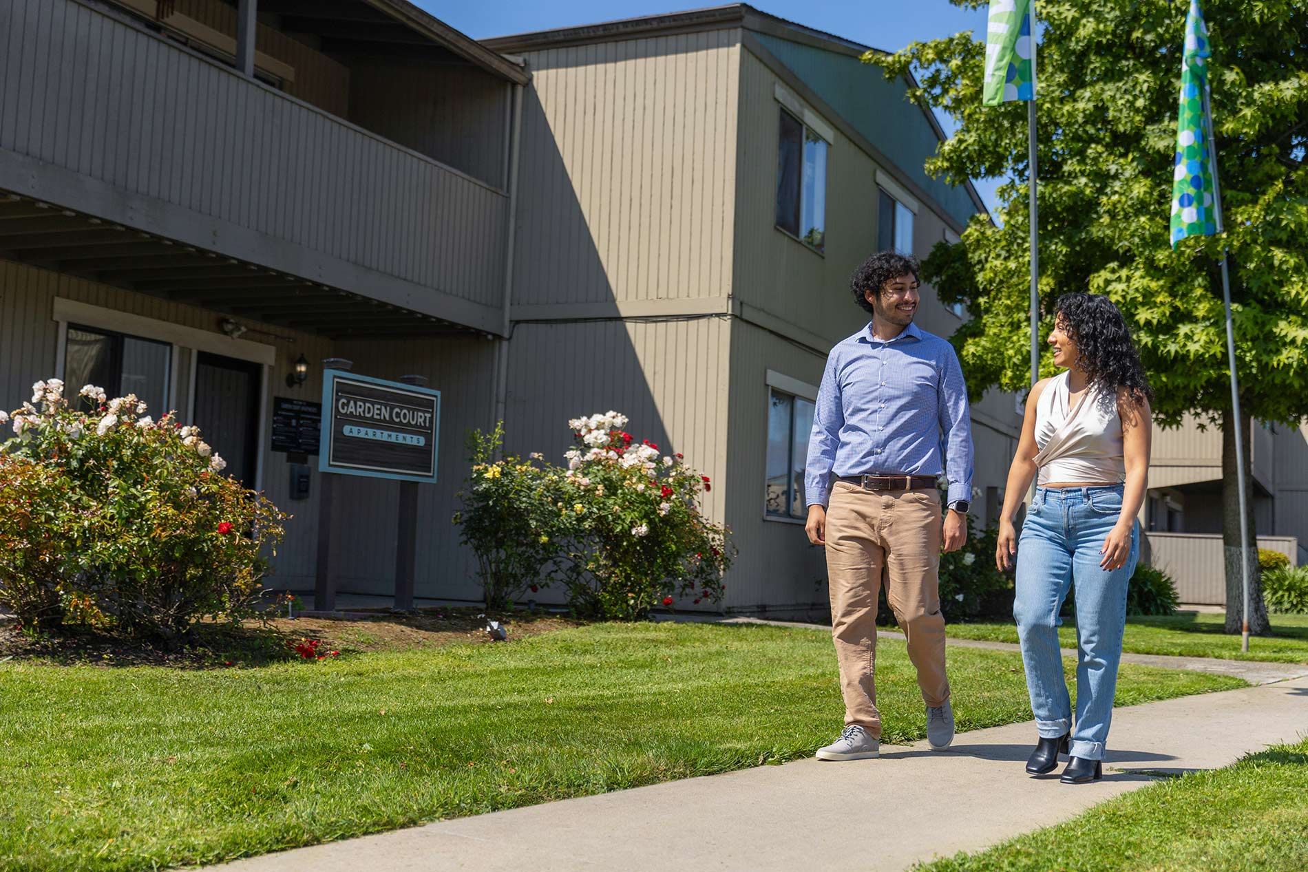 Garden Court couple walks by property