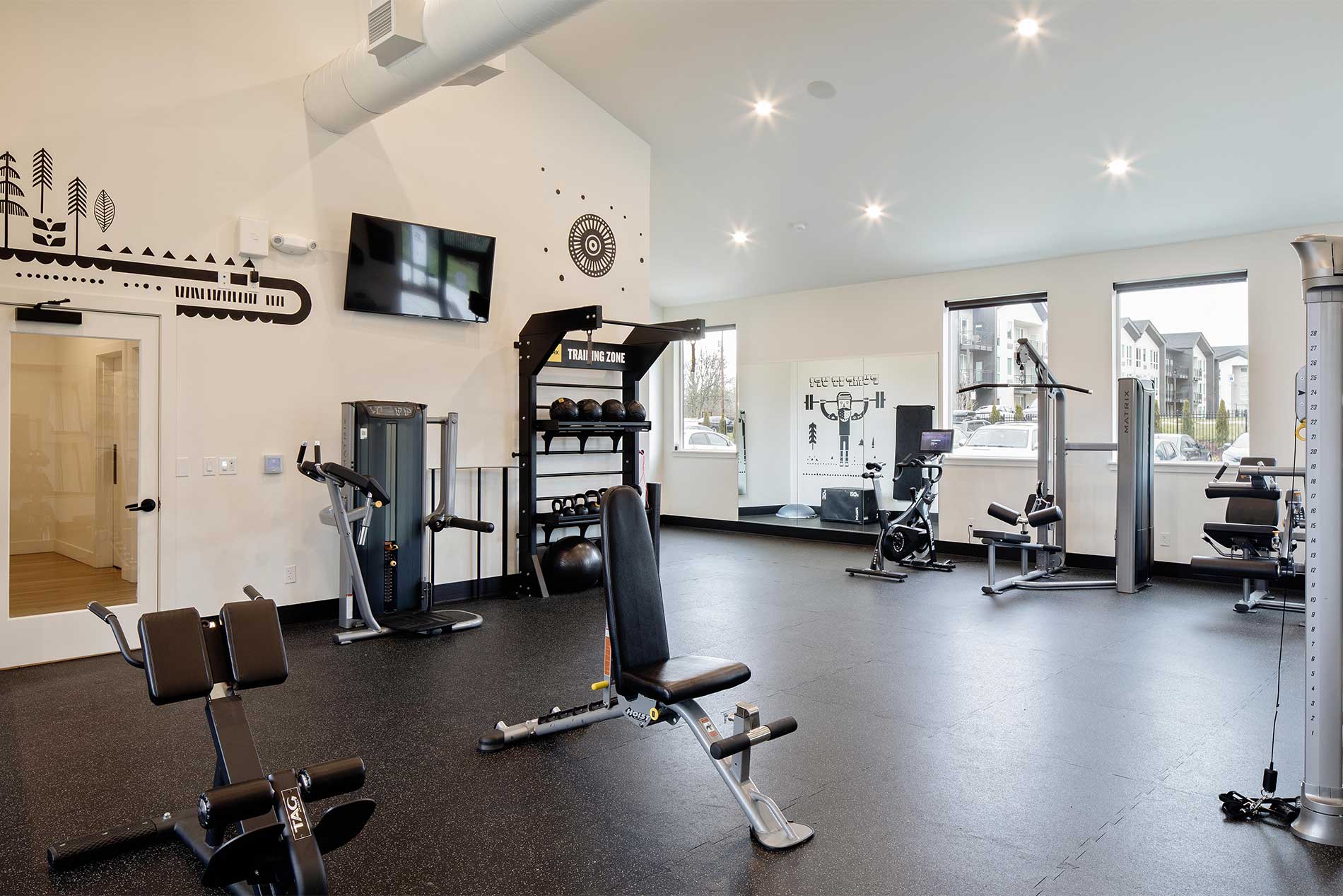 Fitness center with cardio equipment at Heirloom apartments
