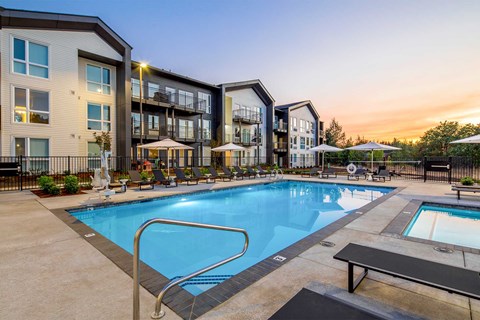 Heirloom apartment community in Portland, OR featuring a resort-style swimming pool, spa, cabanas, and sun deck