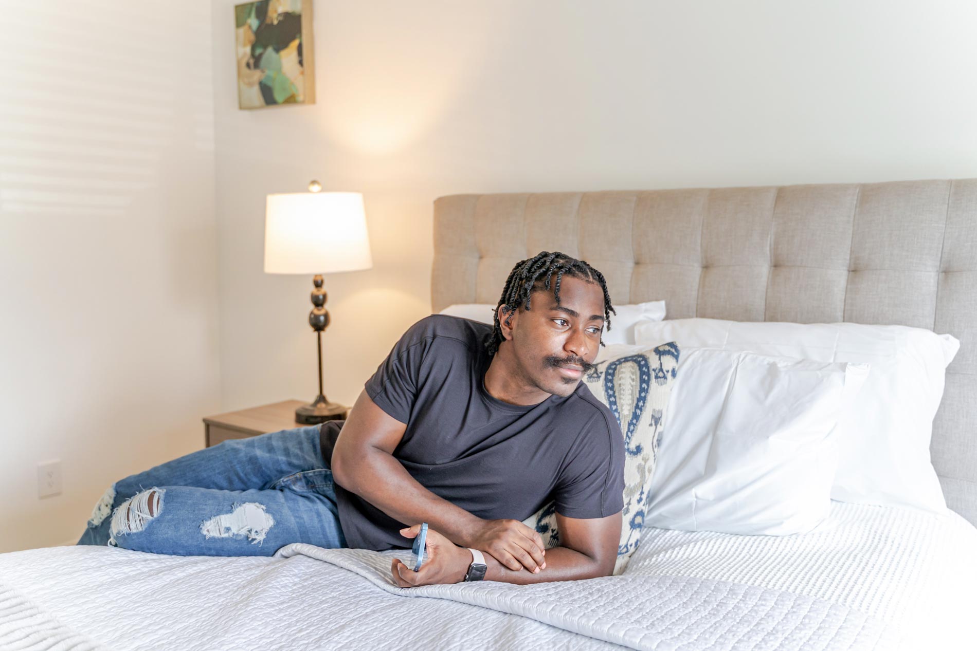 Hickory Run man sits on bed