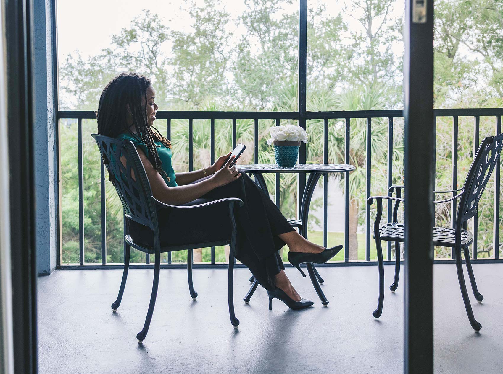 Inlet Bay woman sits on patio