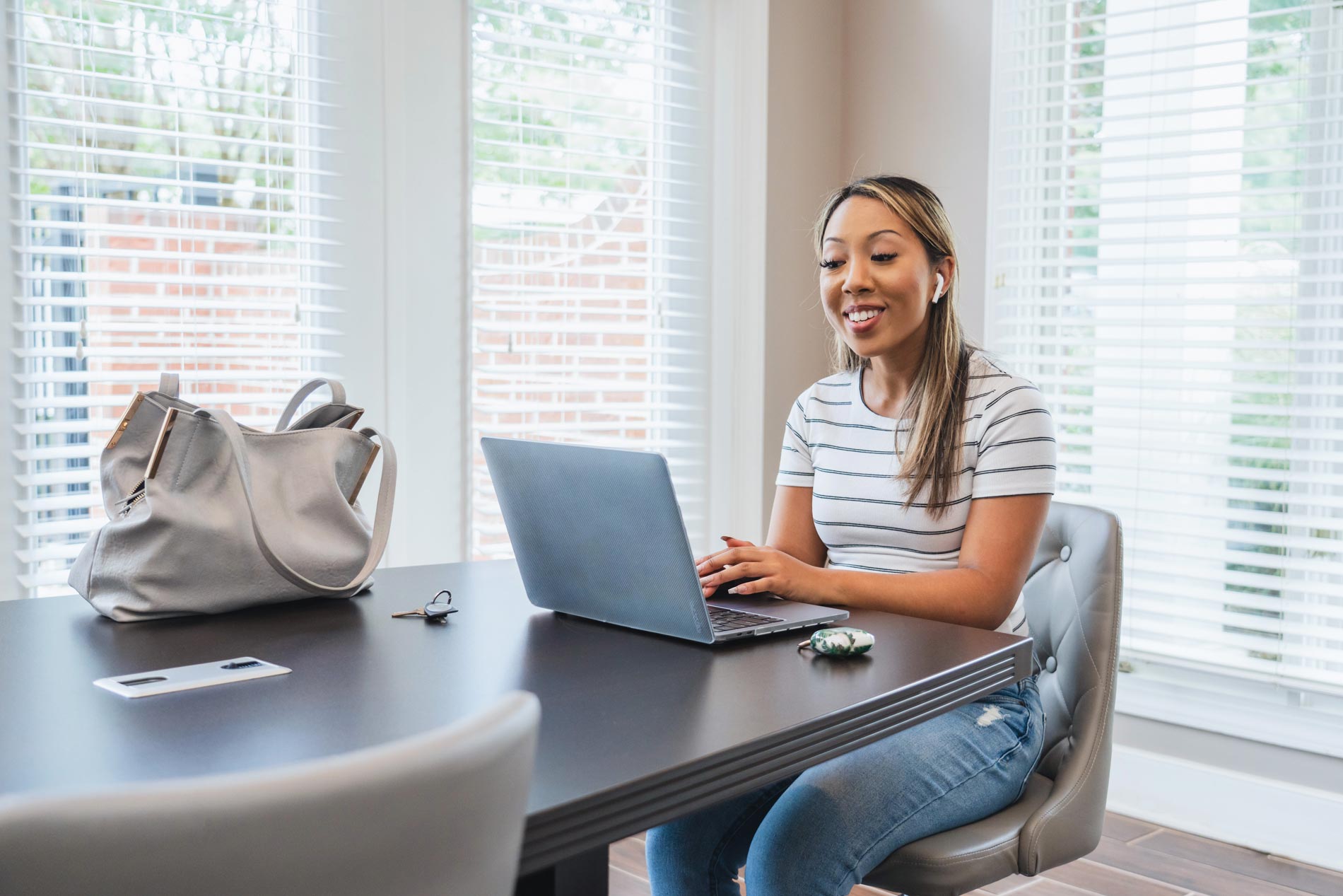 Legacy At Mayland woman on laptop in conference room