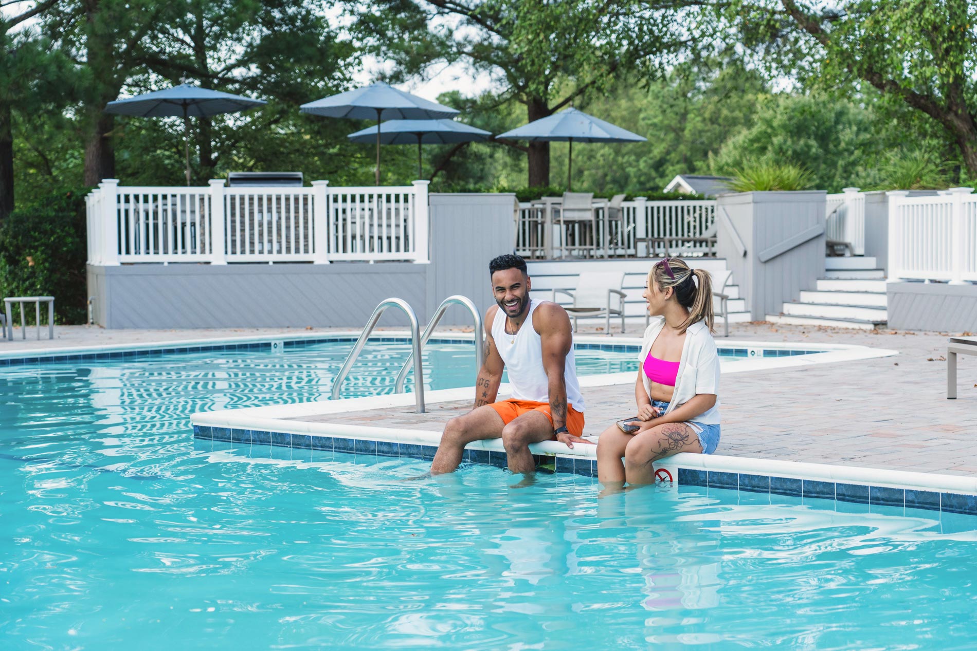 Legacy At Mayland man and woman sit by pool