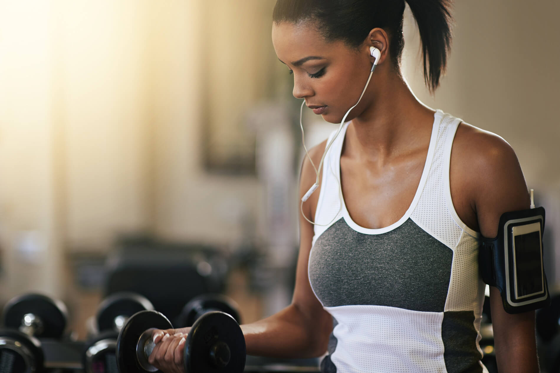 Woman lifting weights in the gym