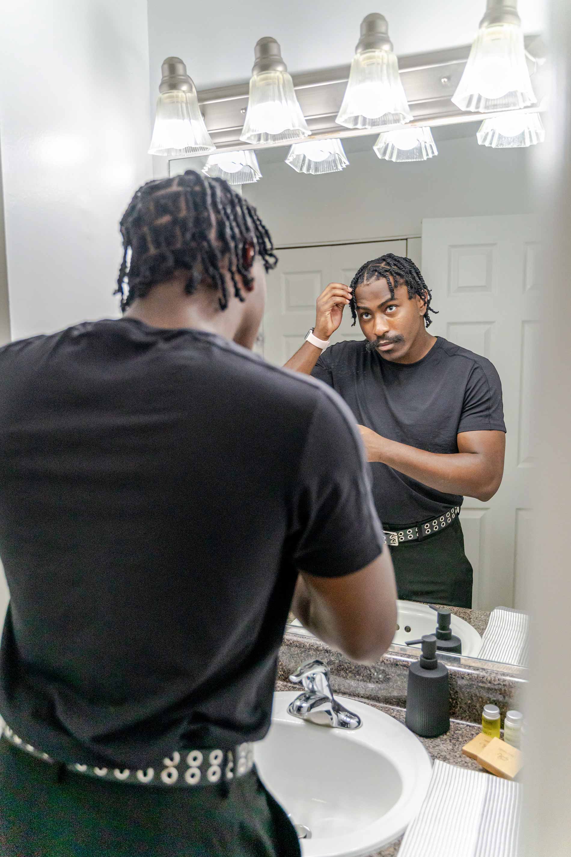 Legacy Hill man gets ready in bathroom