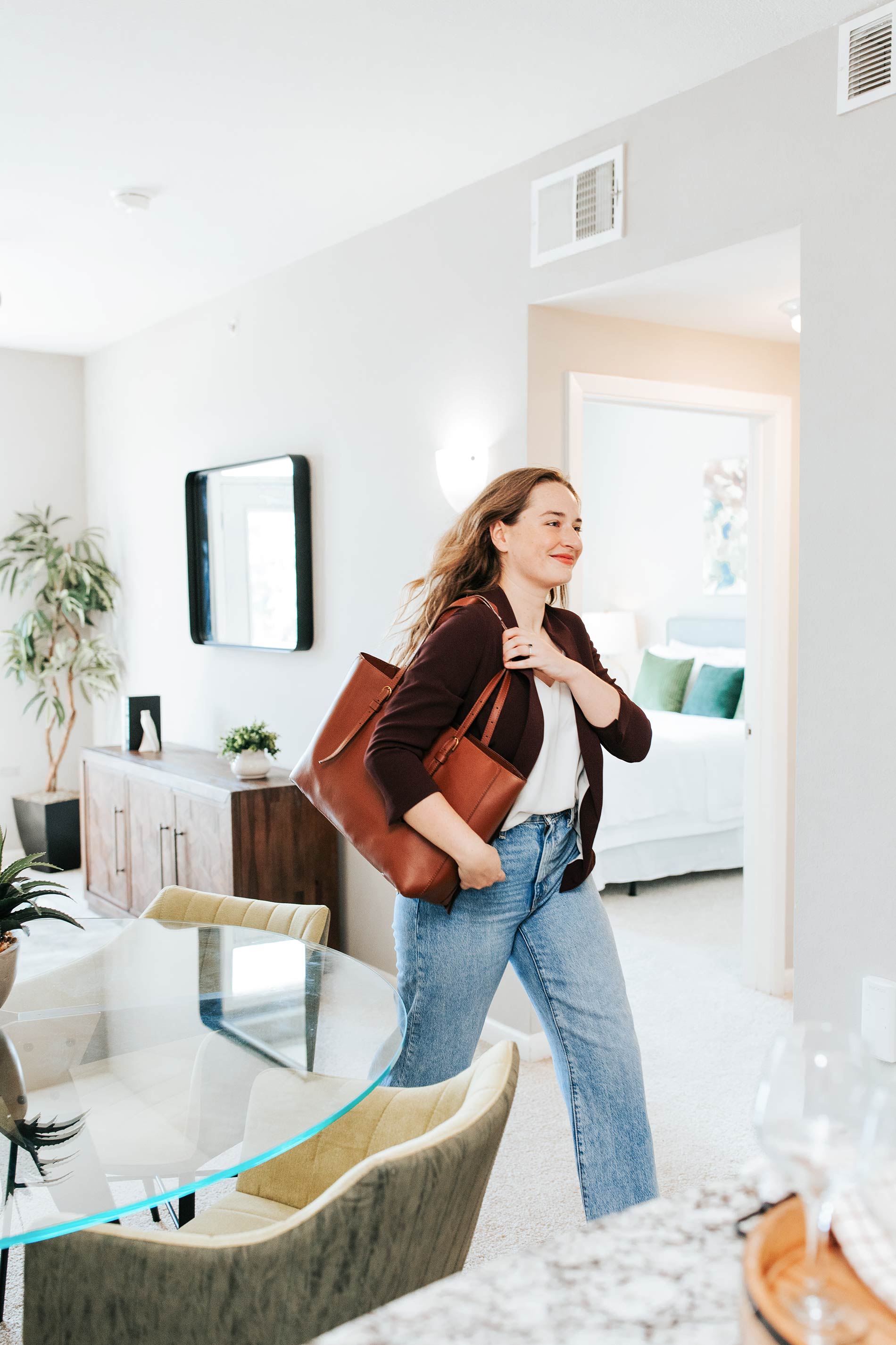 Legacy Village woman exits staged apartment with purse