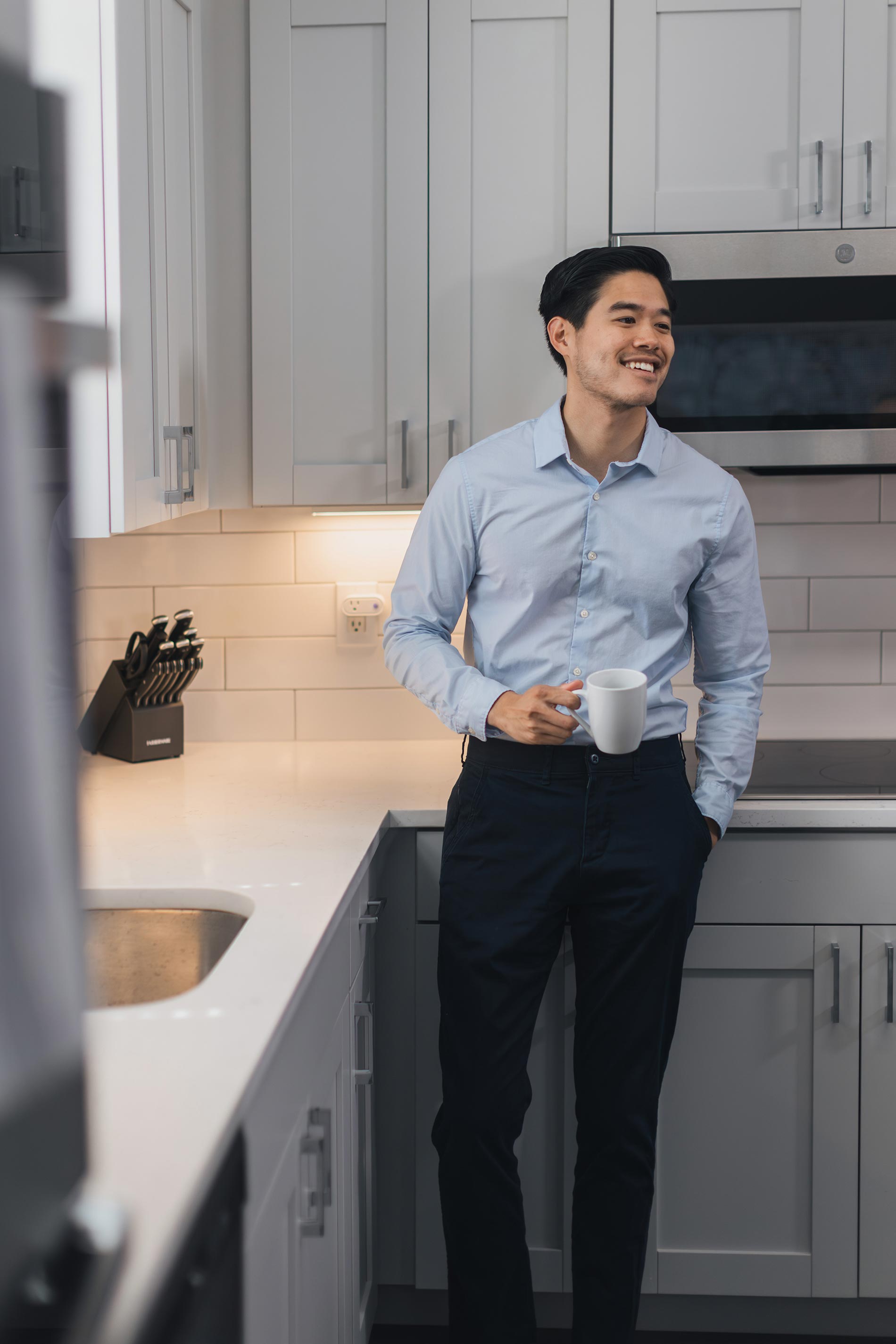 Lenox Farms man stands in kitchen with coffee