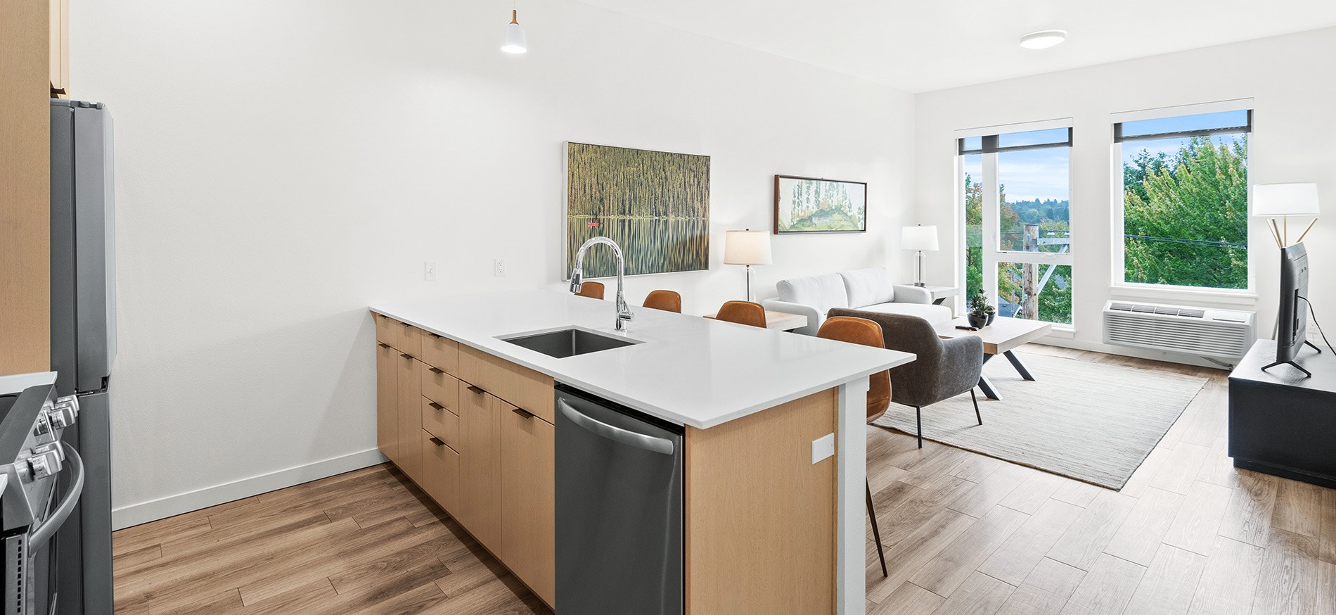 Updated unit at Meetinghouse apartments in the Sellwood Moreland neighborhood of Portland features stainless steel appliances and quartz countertops