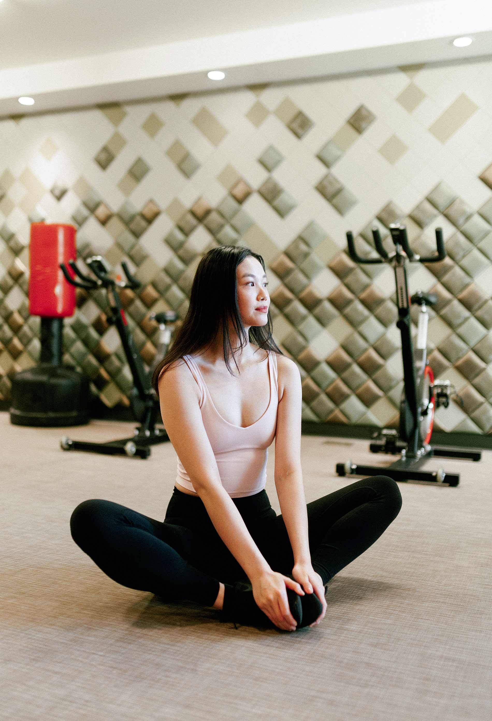 Milehouse woman stretches in yoga room