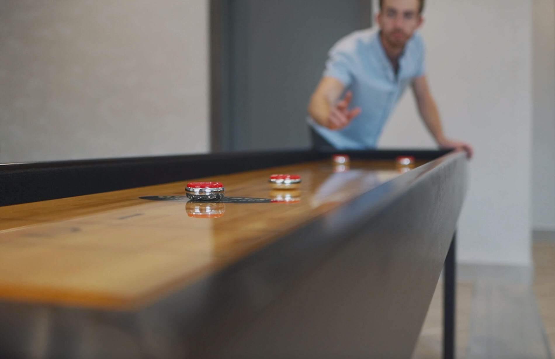 Person playing shuffleboard 